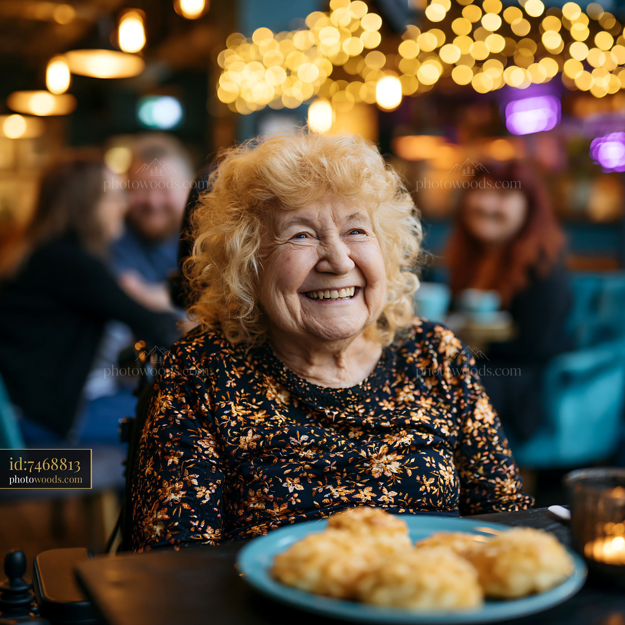 Laughing Grandmother in a Cafe With Friends Enjoying Lunch