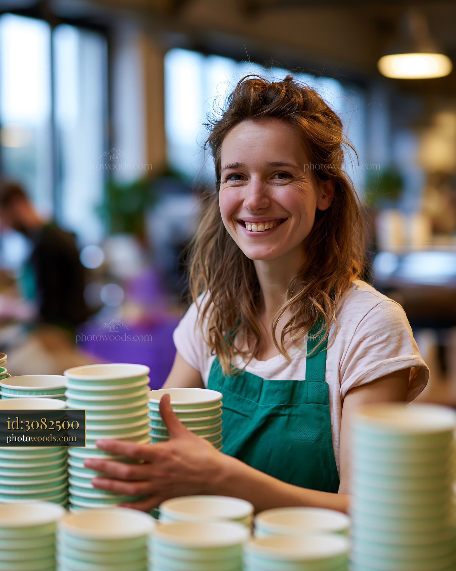 Sustainability Team Member Stacking Cups in Workshop