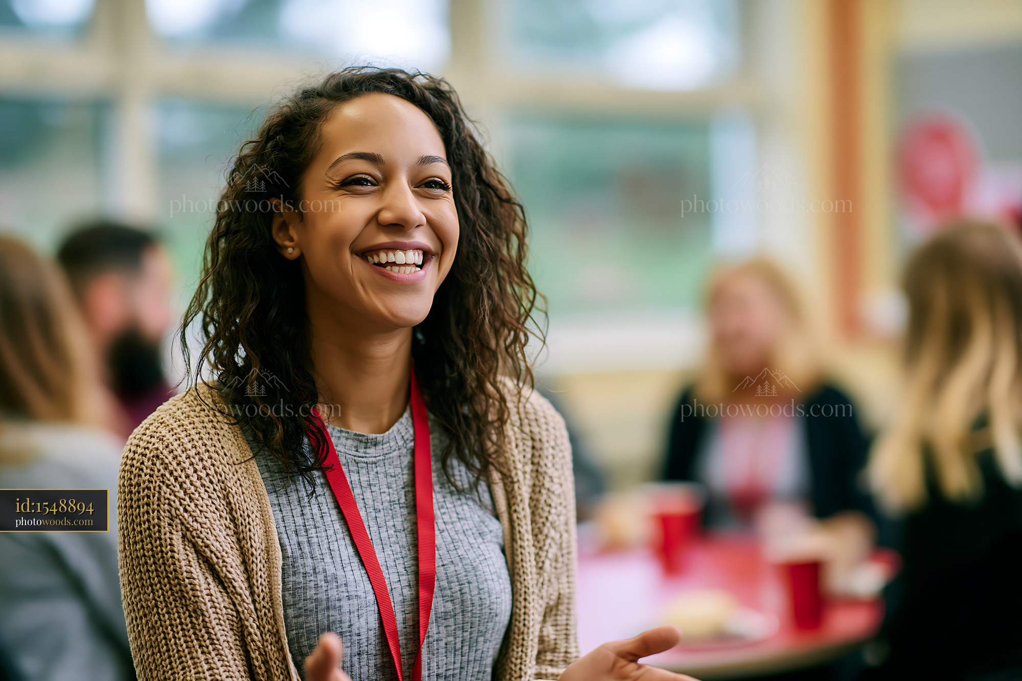 Deaf Teacher Using Sign Language Laughing in a Classroom Setting