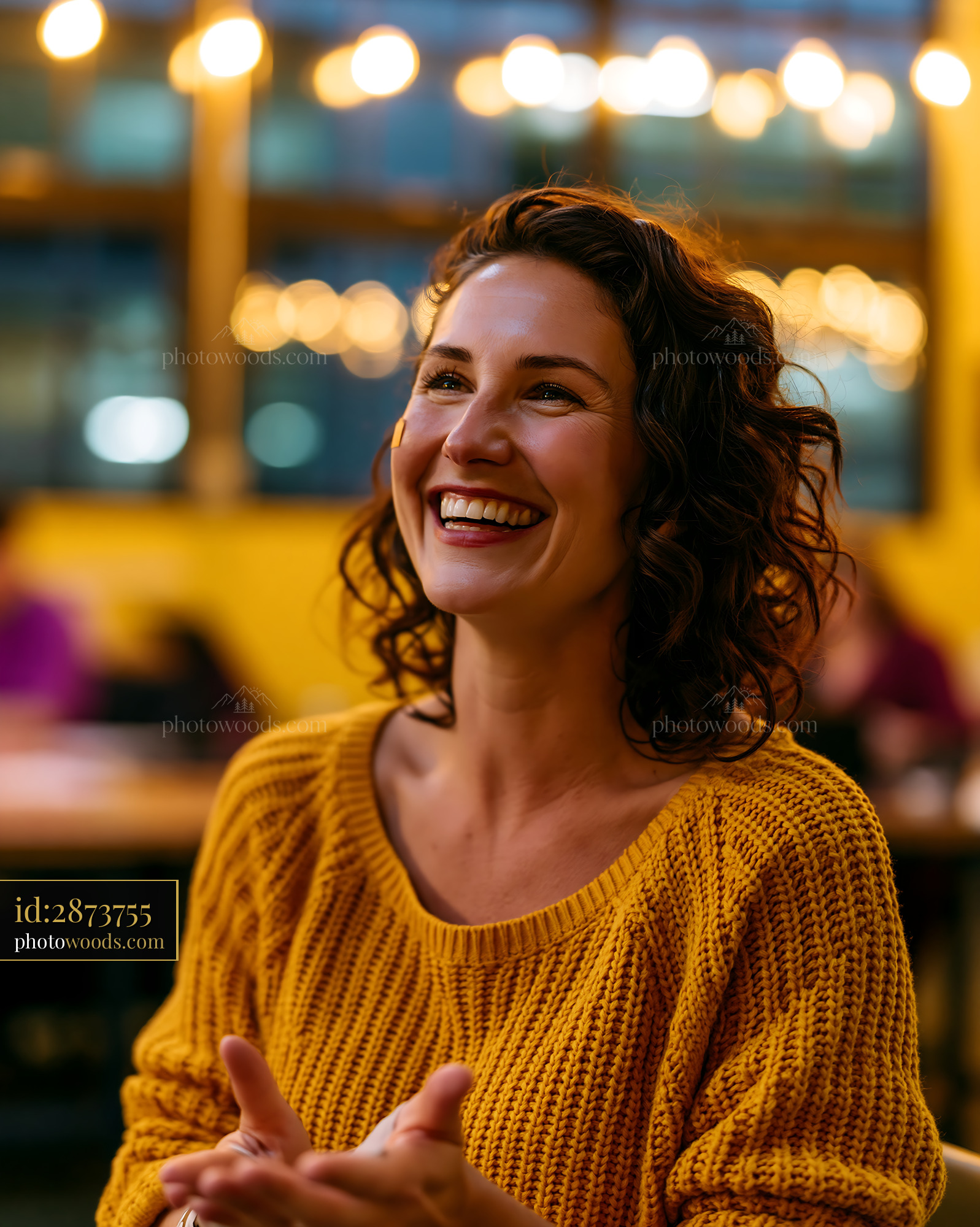 Joyful Teacher Using Sign Language Laughing in Classroom Setting