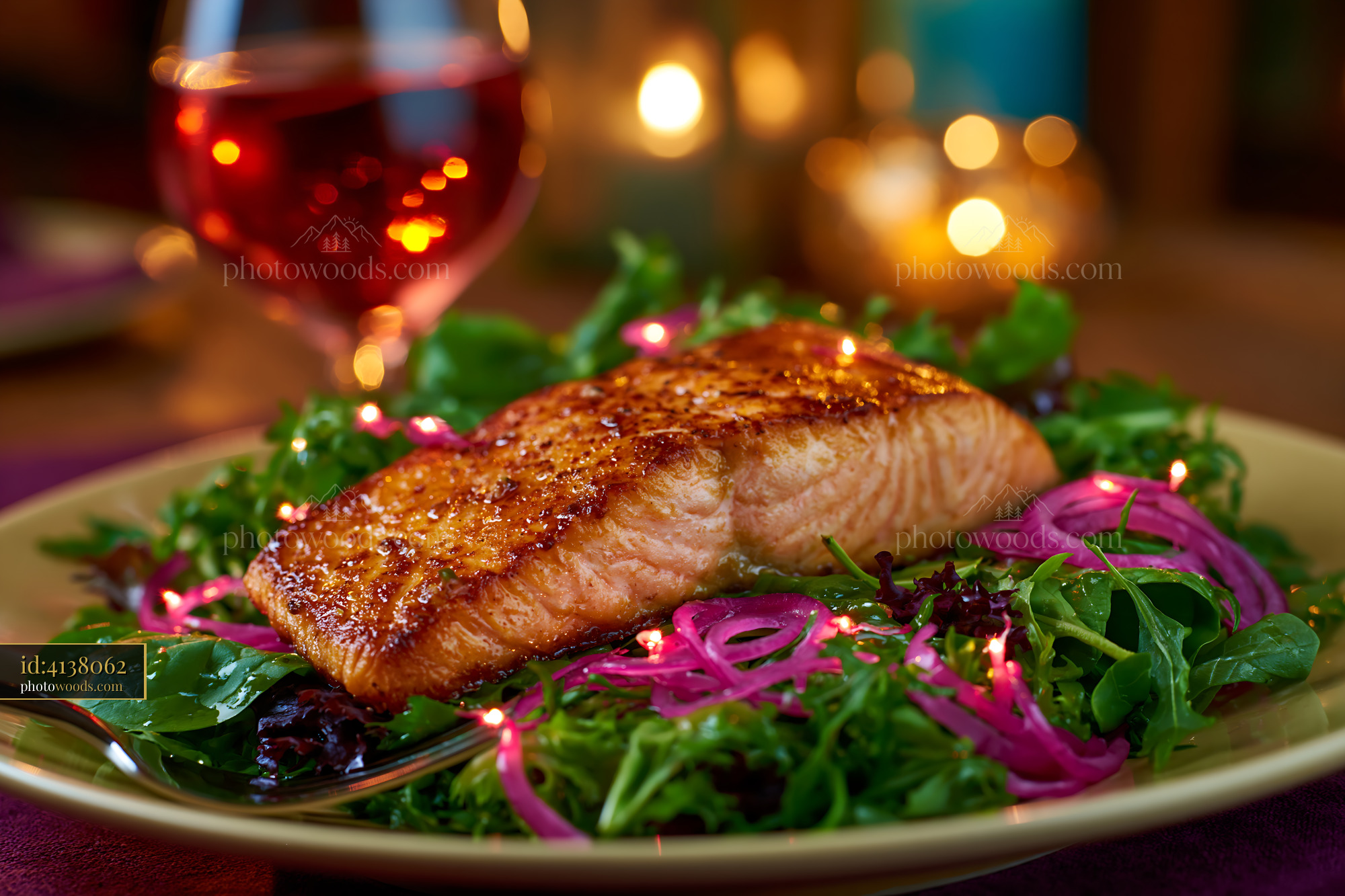 Seared Salmon Fillet on Fresh Greens With Candlelight Backdrop