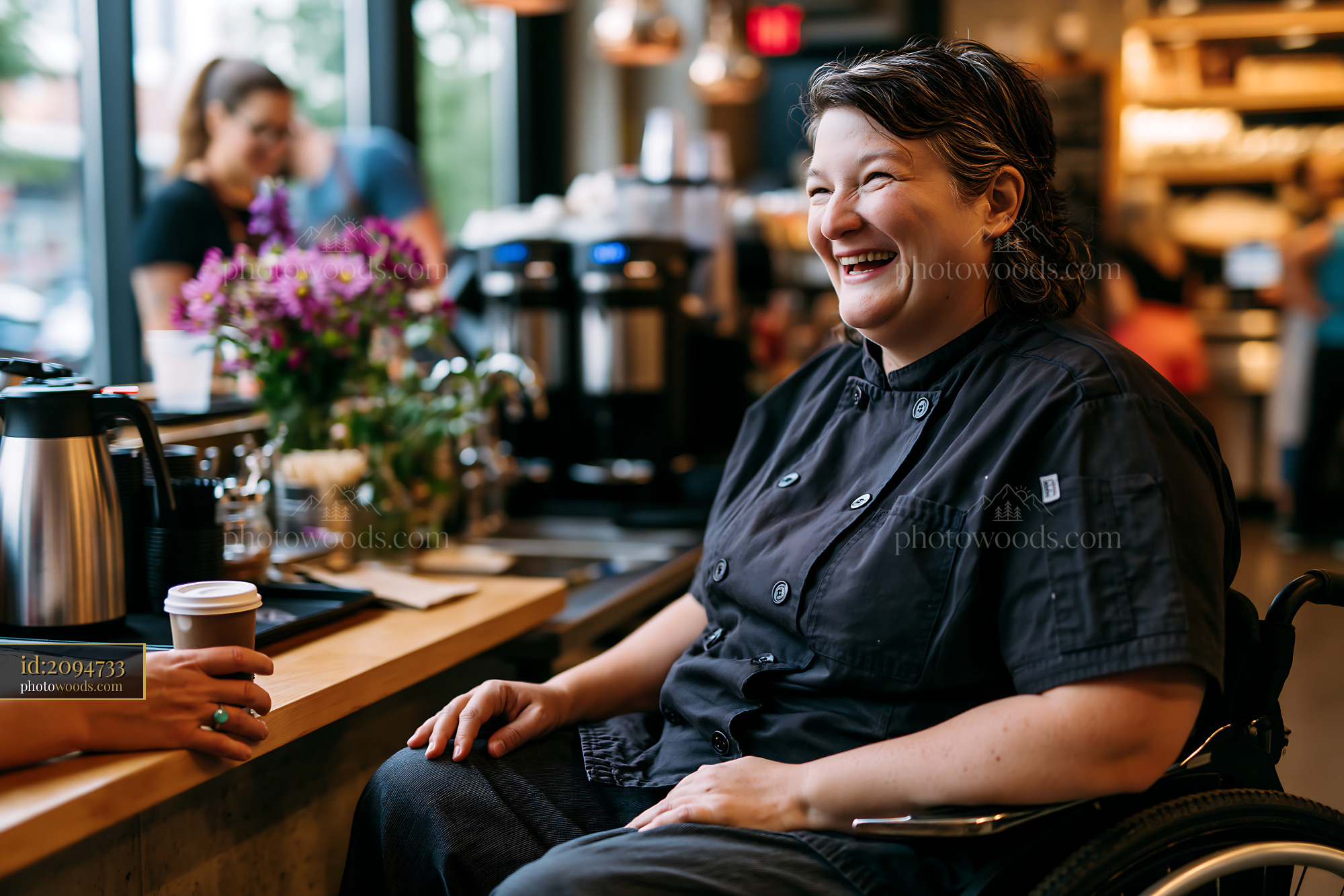 Joyful Chef in a Wheelchair at a Caf? Counter With Flowers