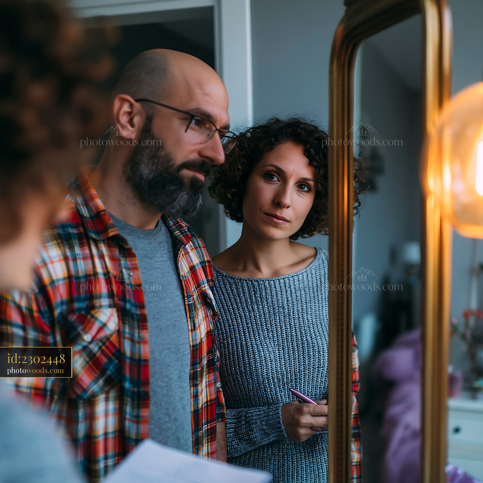 Couple Reviewing Mortgage Contract in Modern Home Setting