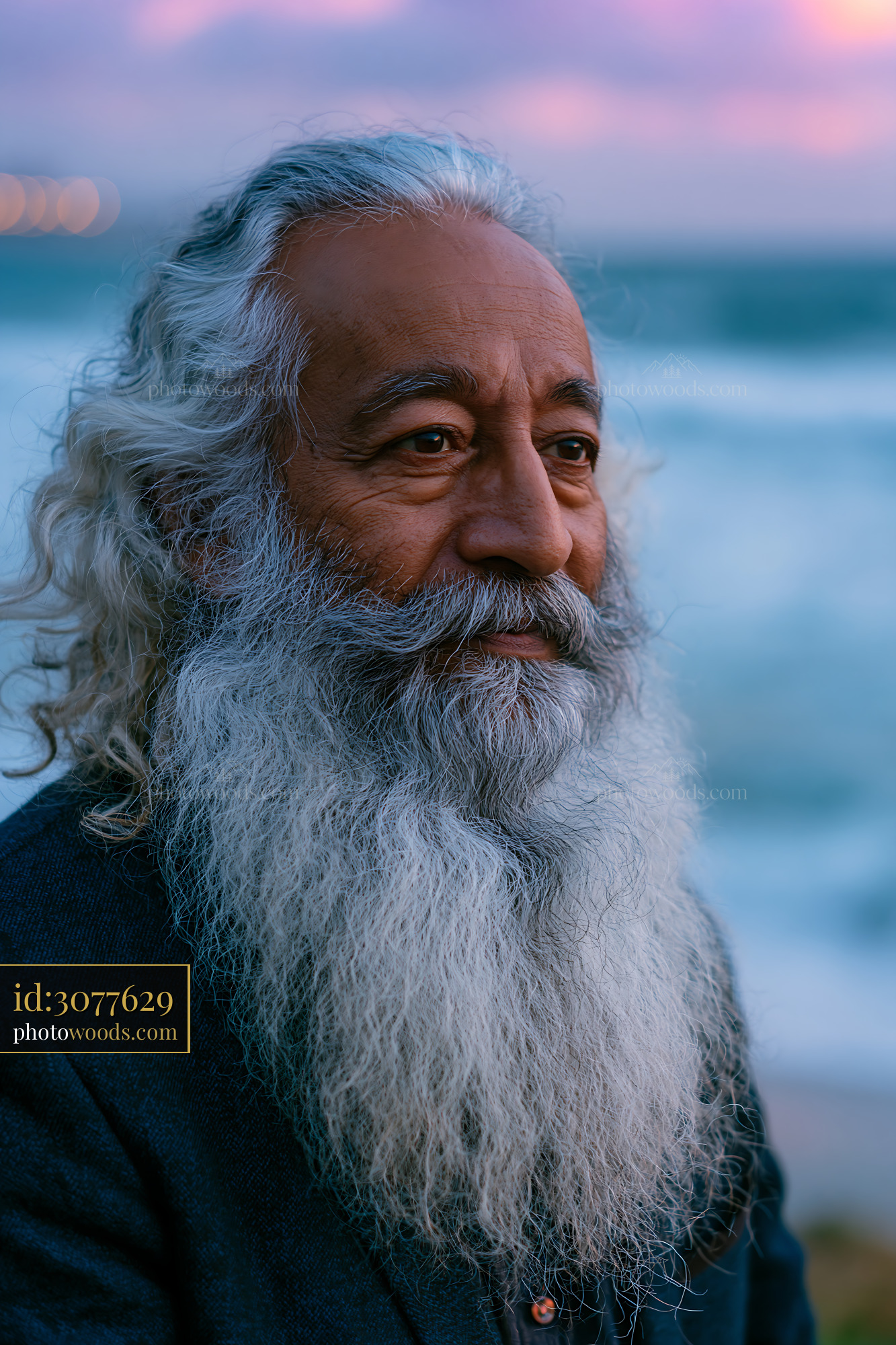 Man With Long Beard Stands Near Ocean During Sunset