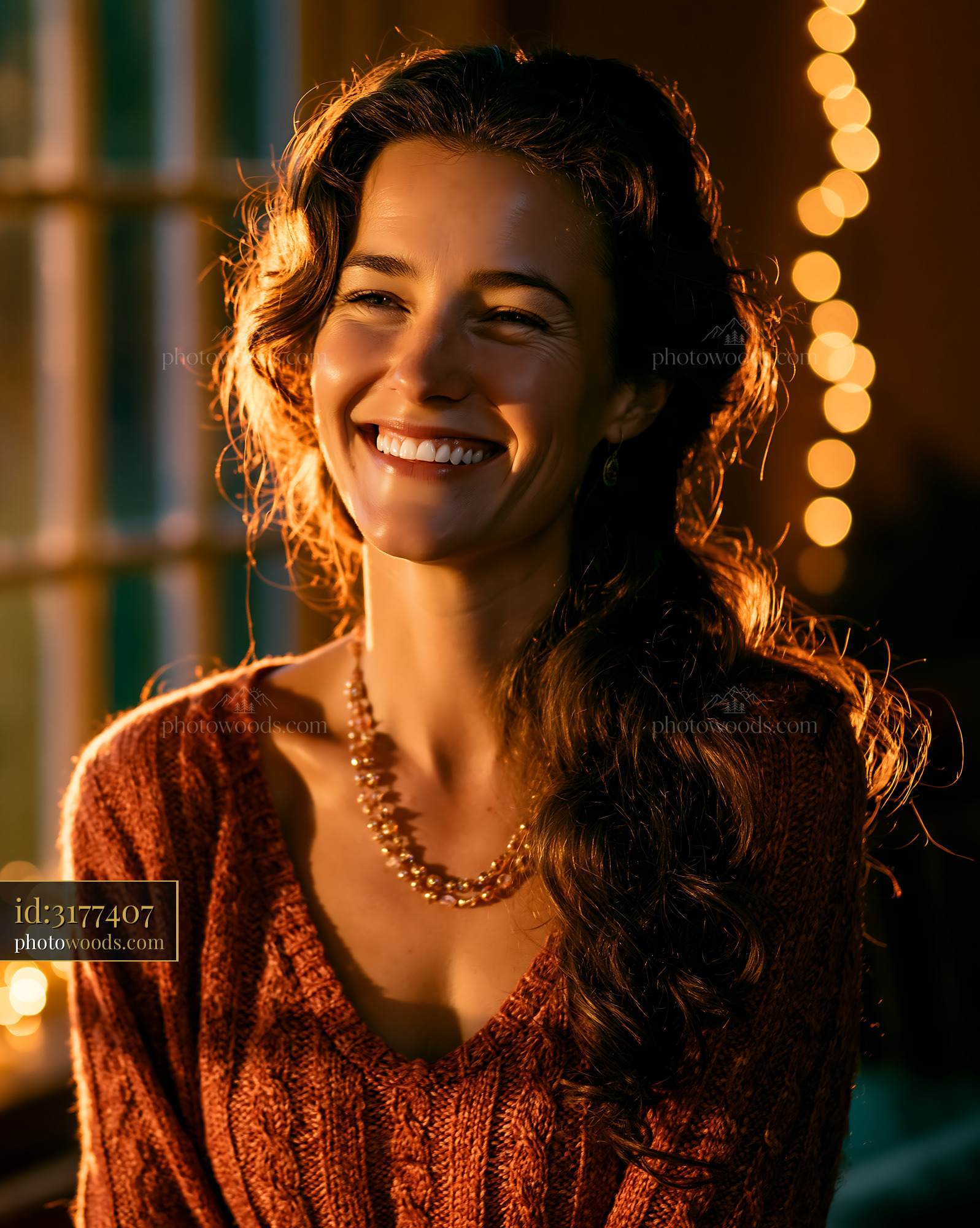 Woman Smiling Brightly in a Cozy Indoor Setting With Warm Lights