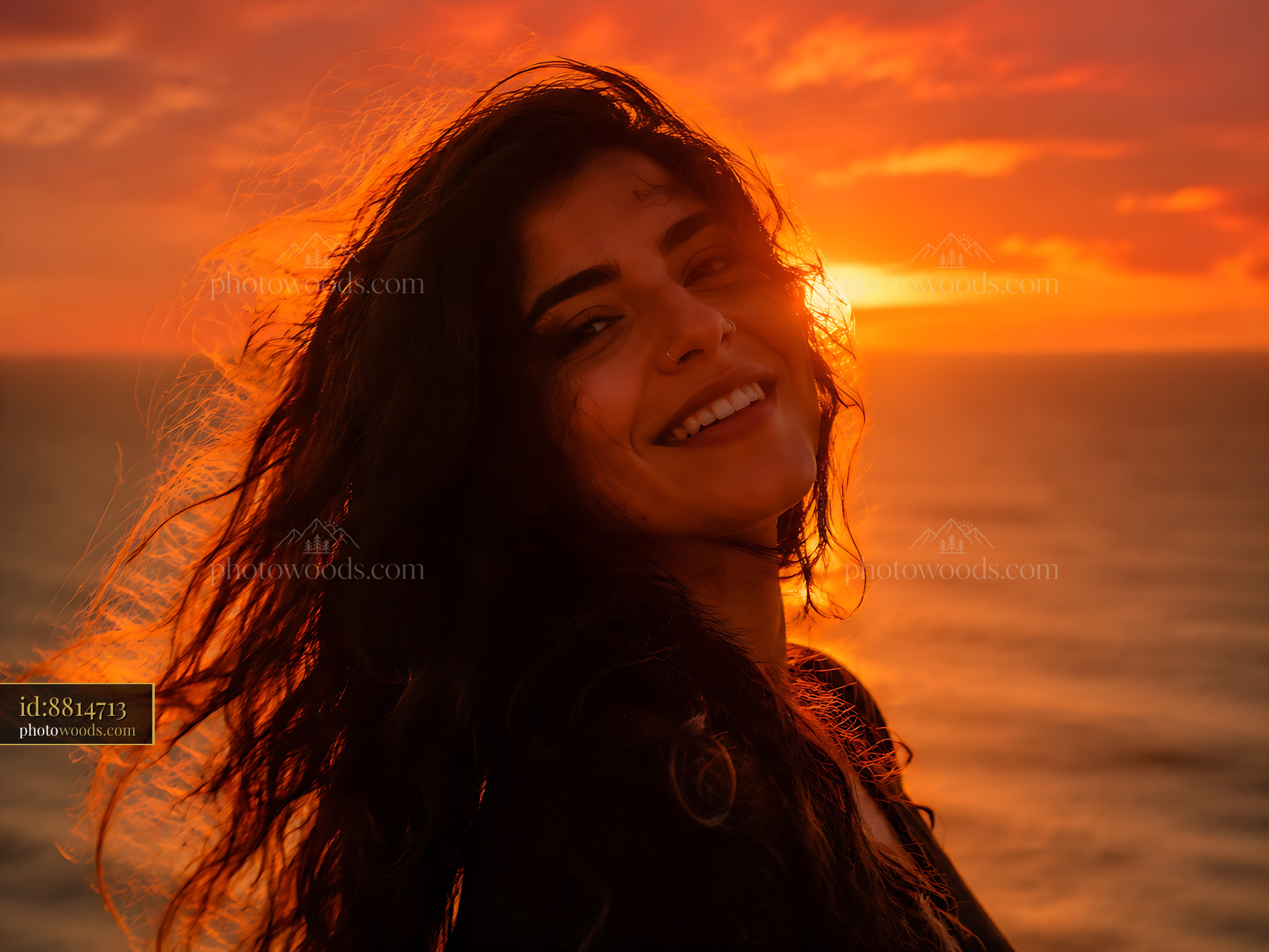 Woman Smiling With Sunset on Beach in the Background
