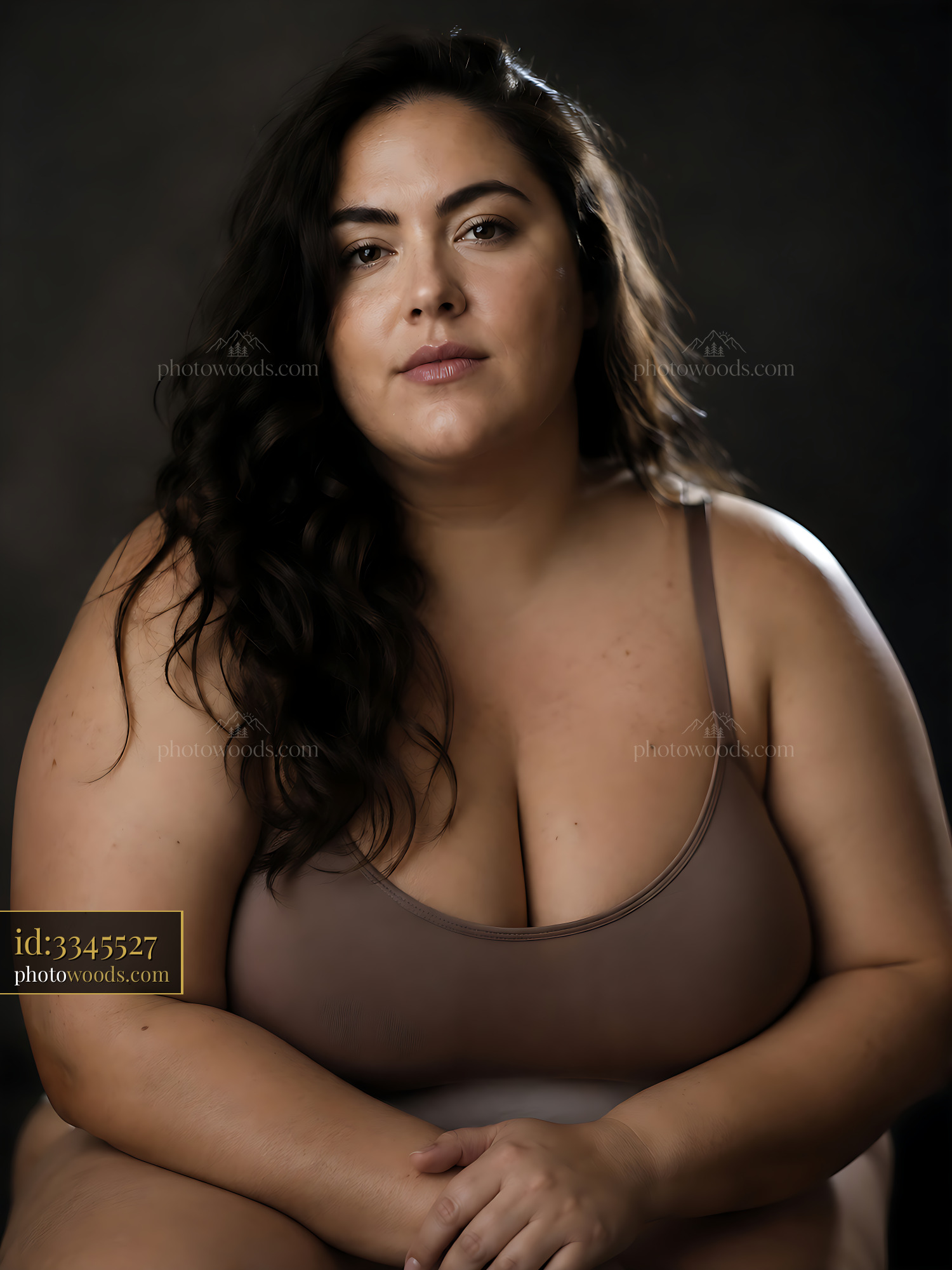 Woman Poses With Confidence in Studio Setting, Soft Light