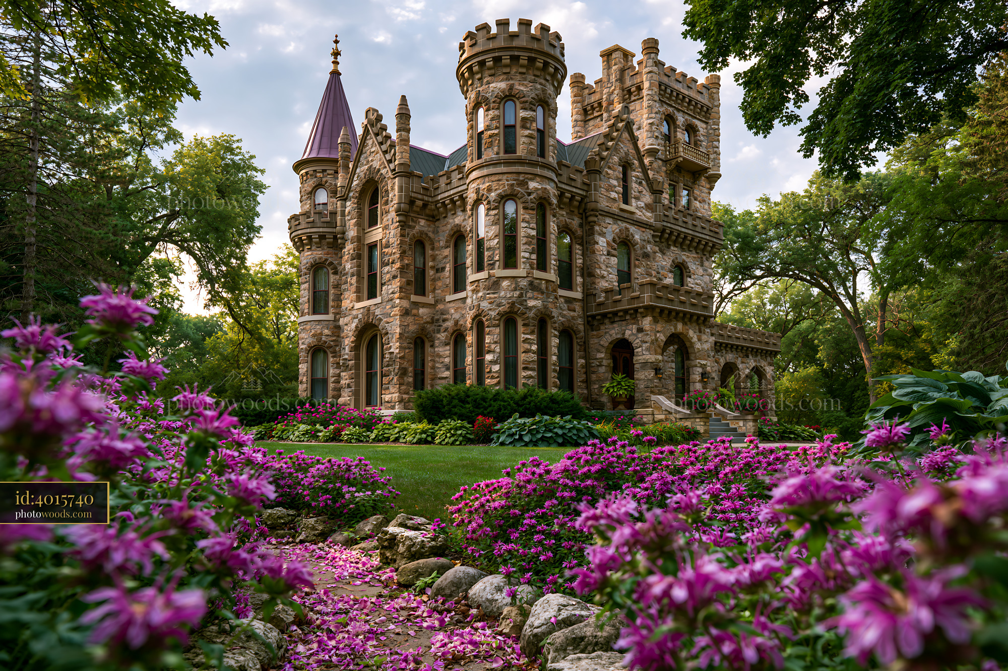 Historic Castle With Purple Flowers in Front