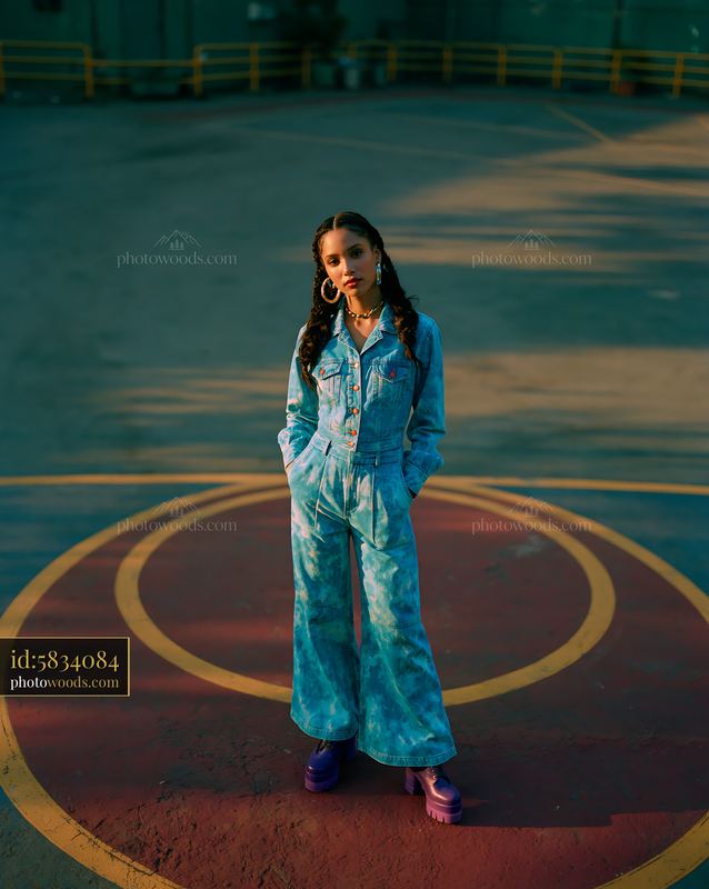 Model With Braided Hair Wearing Acid Wash Outfit in Urban Setting