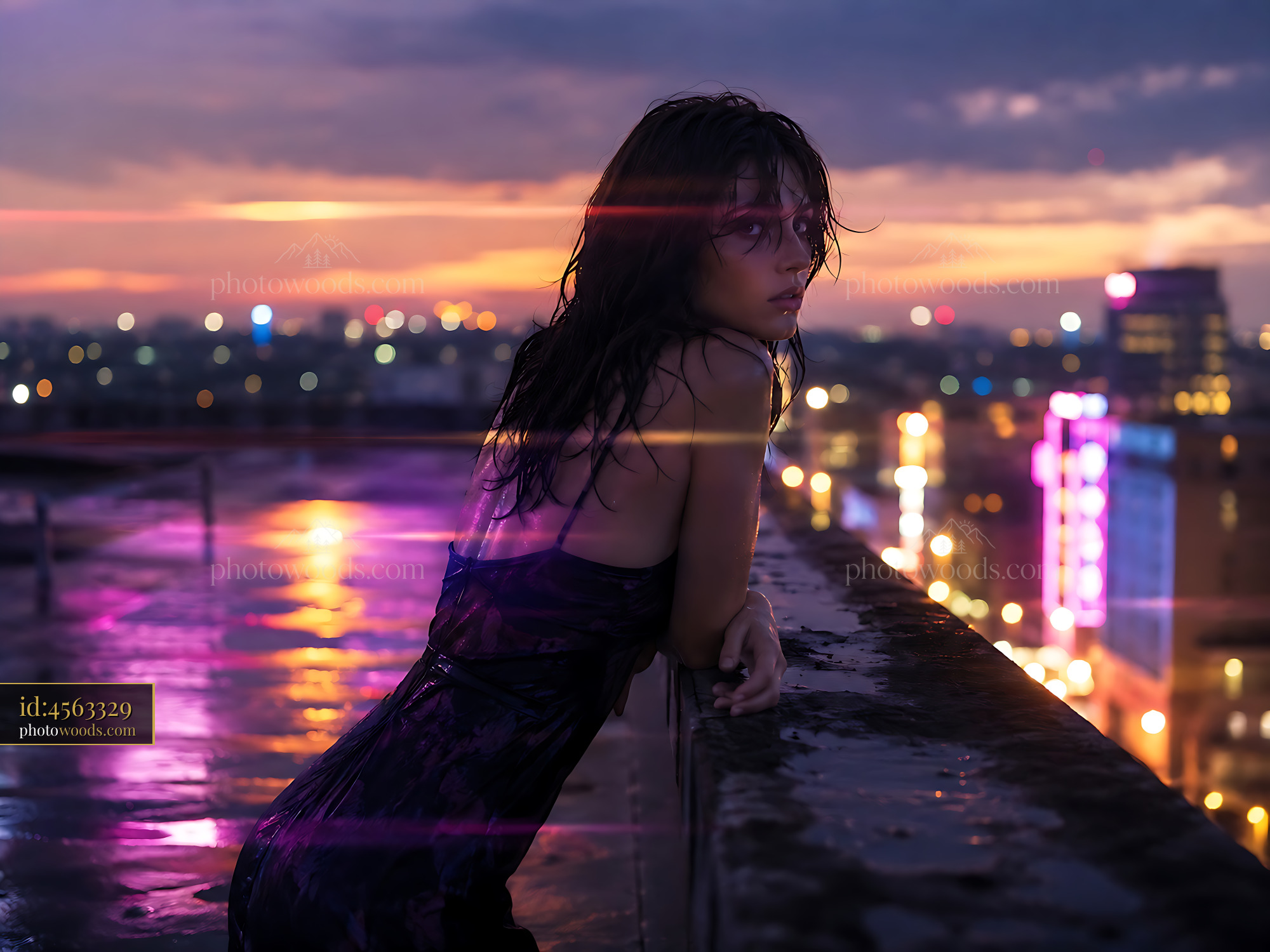 Woman in Wet Dress Looking Over City Skyline at Sunset