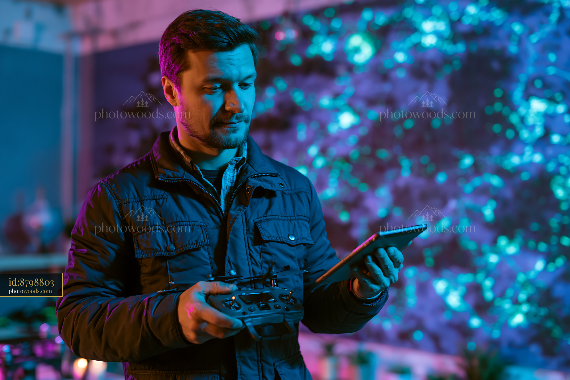 Farmer Using Drone Controller and Tablet at Night With Colorful Lights