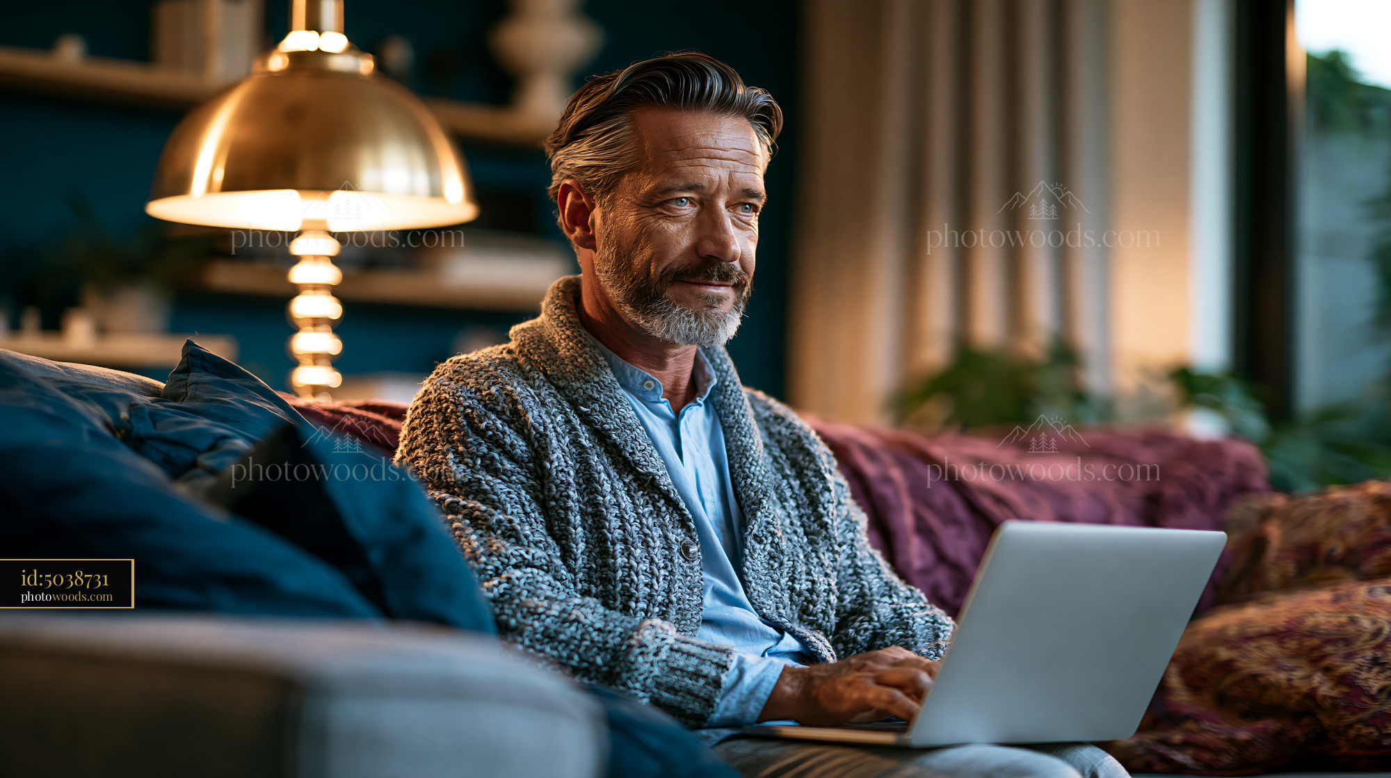 Man Using Laptop in Living Room During Evening at Home