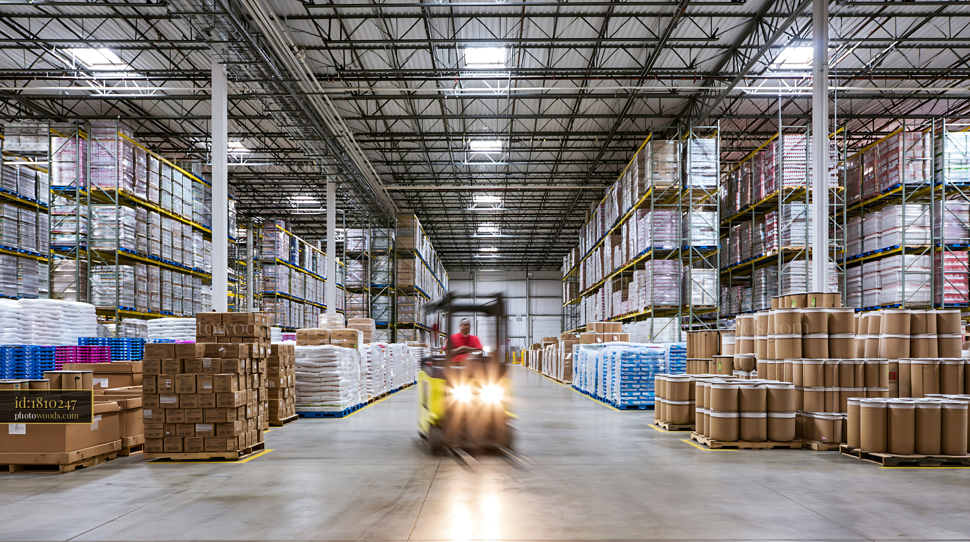 Forklift Operator Moving Pallets in a Warehouse Facility