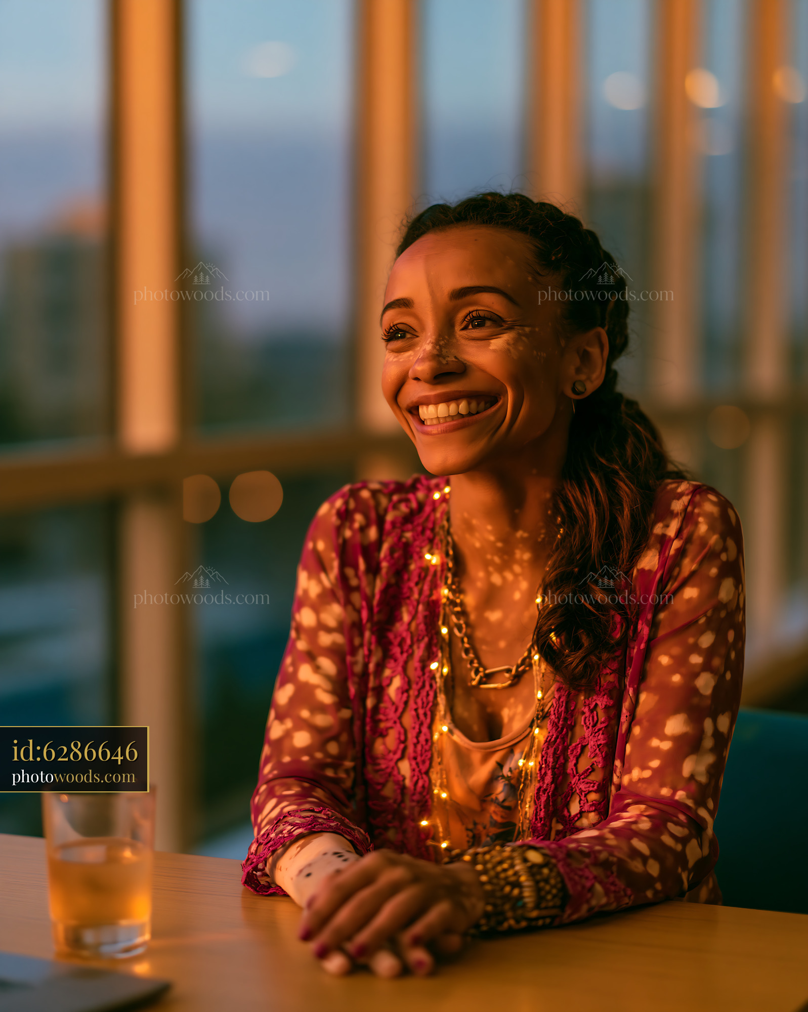 Cheerful Woman With Vitiligo Smiling in Warm Sunlight Indoors