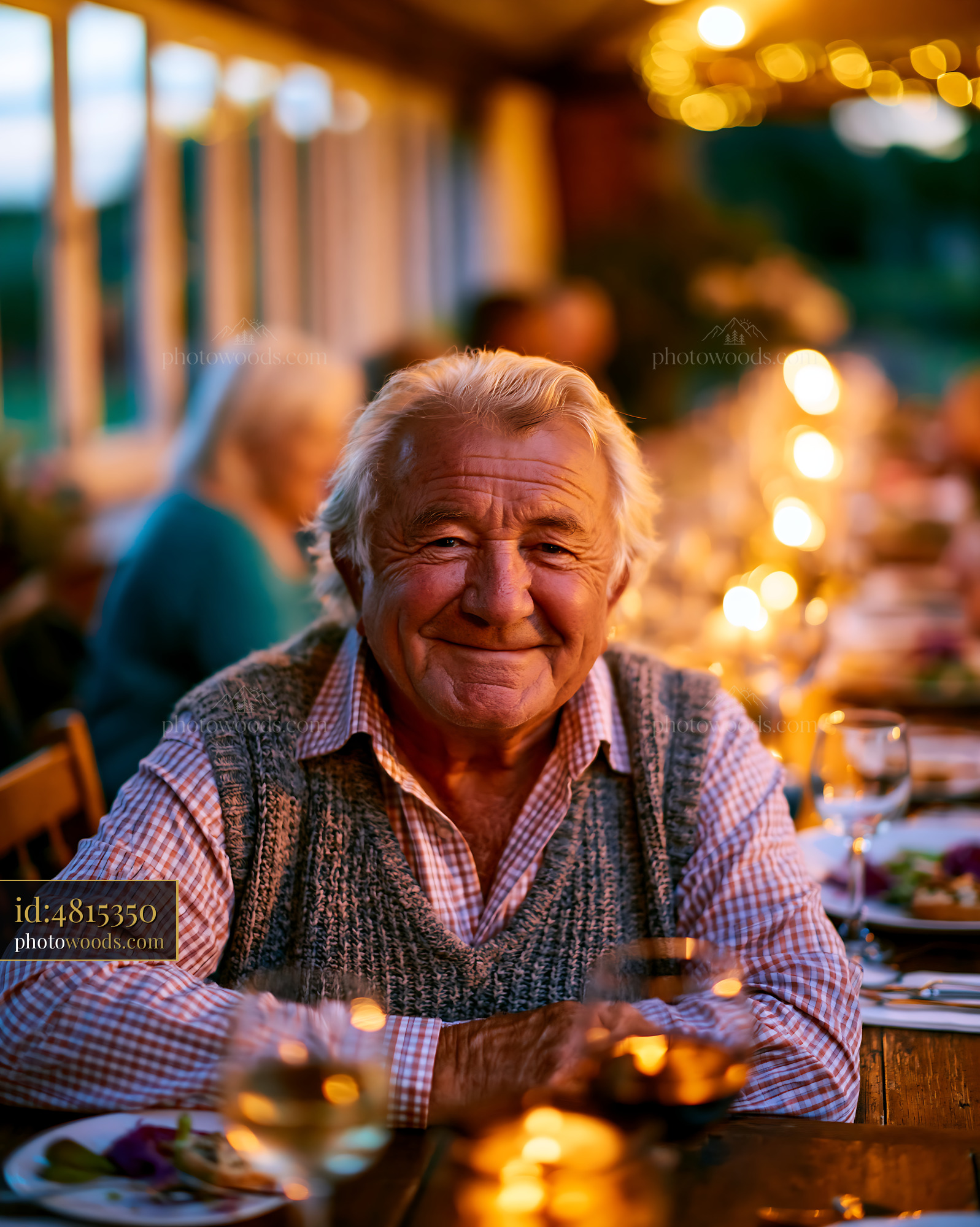 Senior Man Enjoying Dinner at Outdoor Table During Evening Gathering