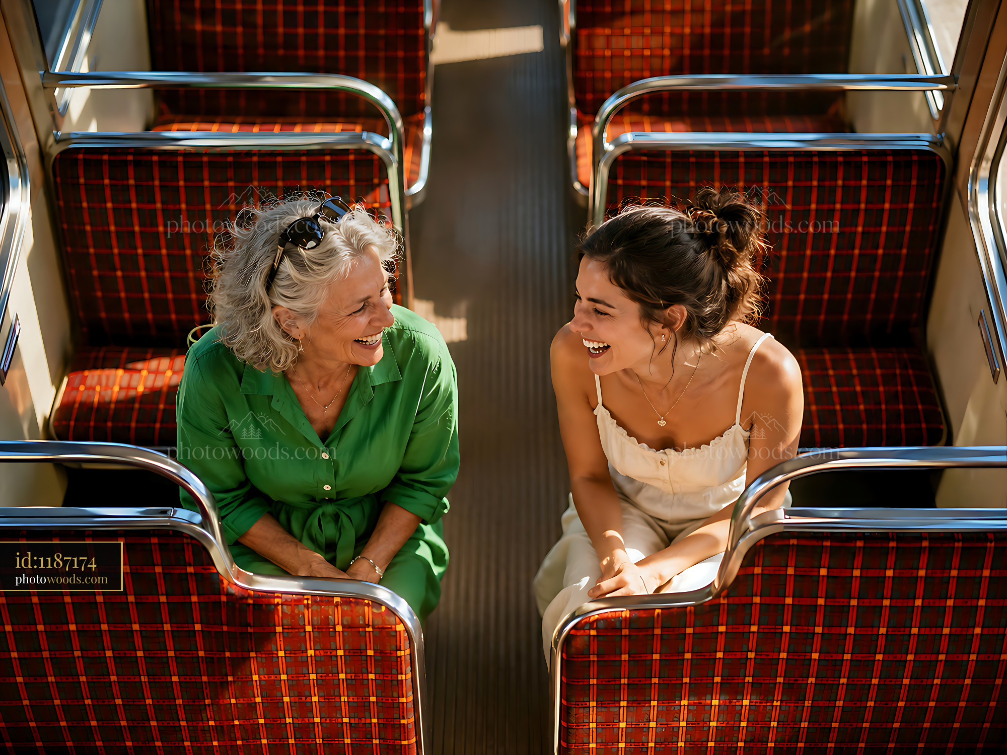 Two Women Enjoying Conversation on a Train in a Bright Setting