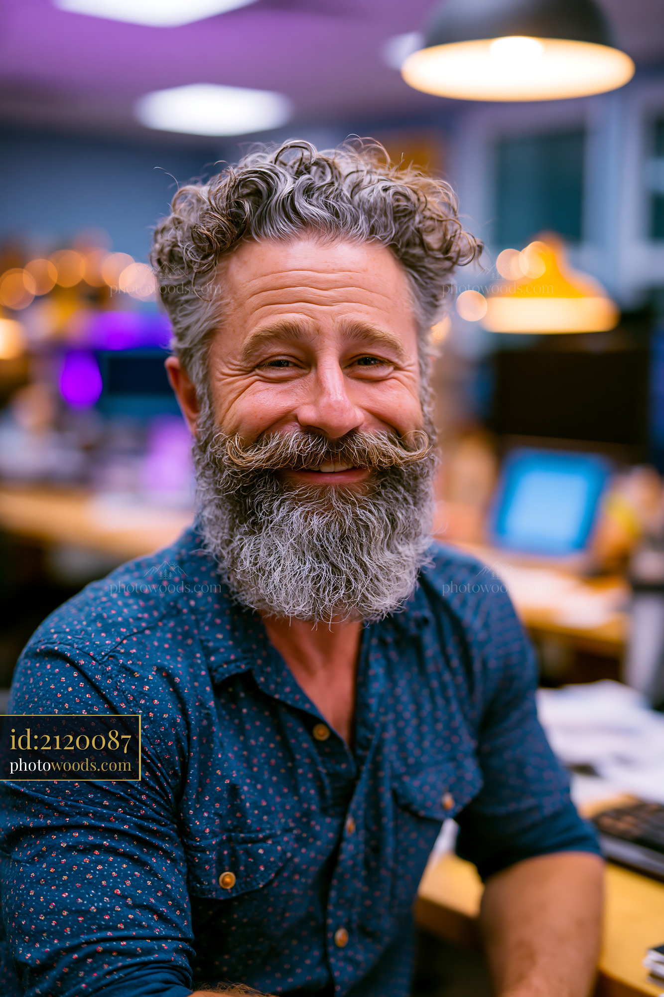 Man With a Beard Seated at a Desk Inside an Office