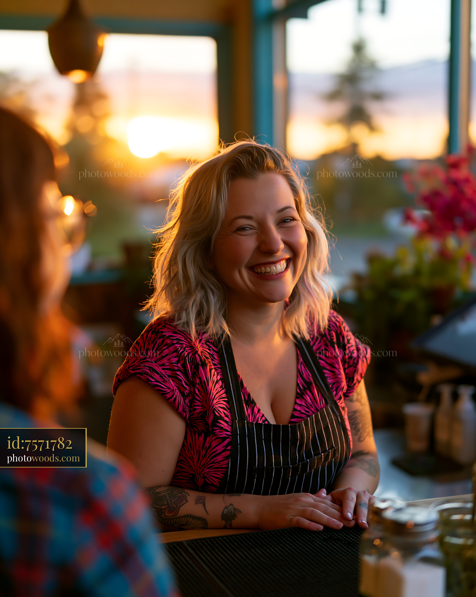 Cheerful Graphic Designer Smiling at Sunset in Caf?