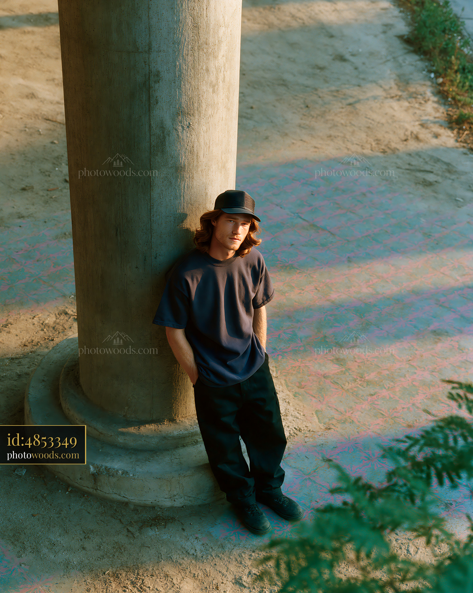 Skater Man Leaning Against a Column at Sunset