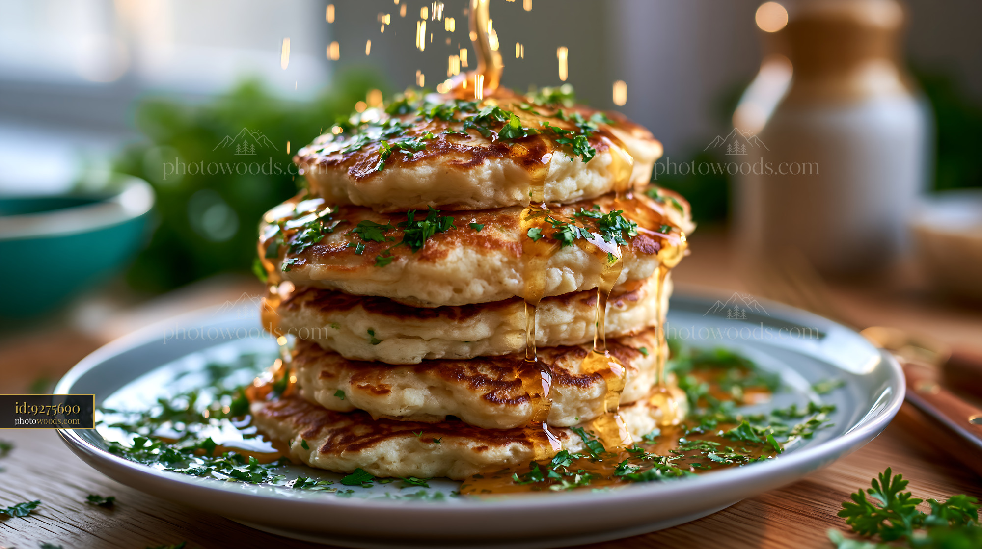 Fluffy Pancakes With Maple Syrup and Herbs on a Wooden Table