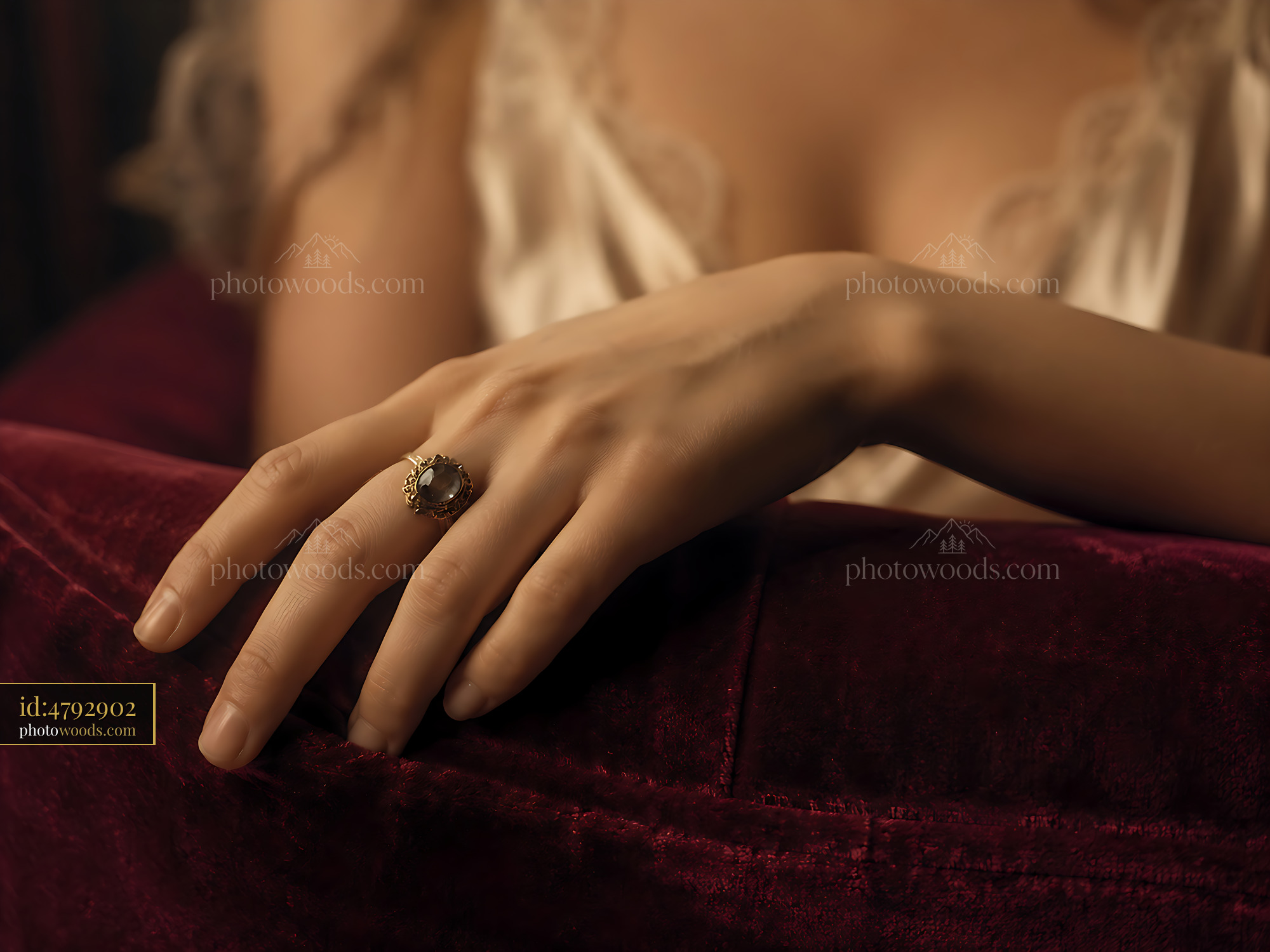 Hand Wearing a Ring Resting on a Velvet Surface