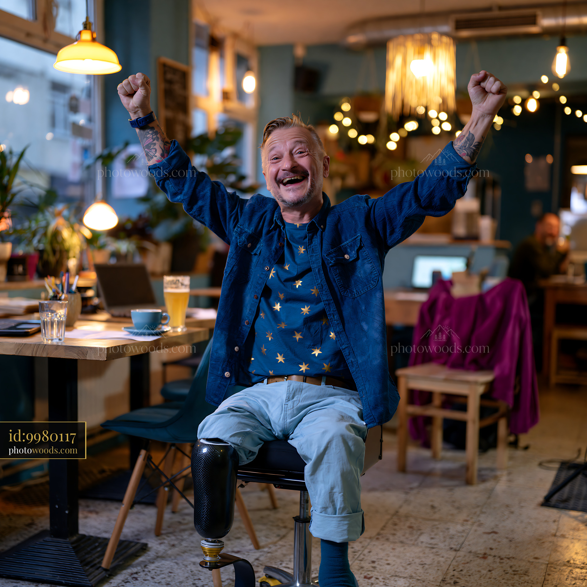 Cheerful Man With a Prosthetic Leg Celebrating in a Cozy Café