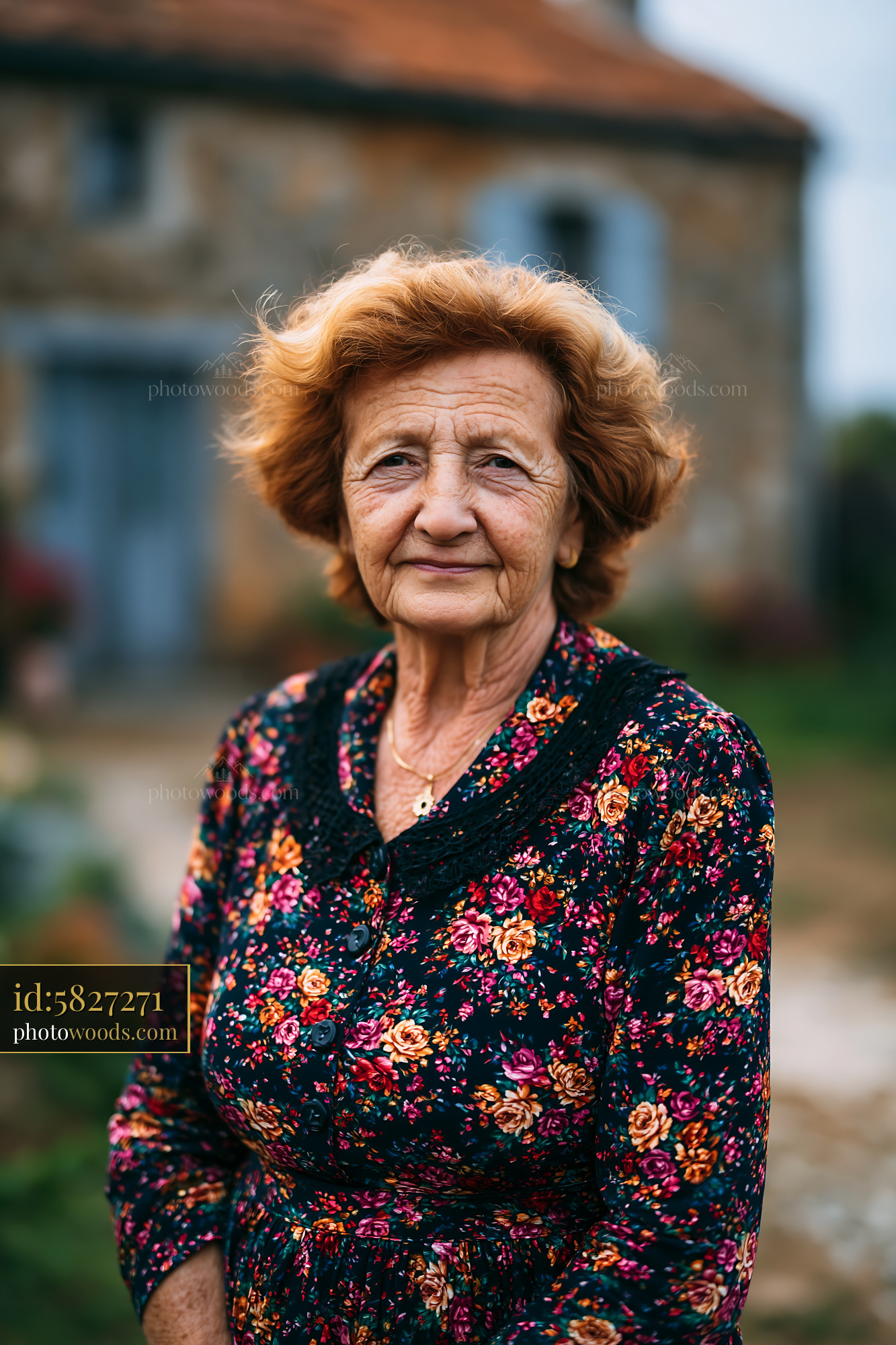 Elderly Woman Stands Outdoors Smiling in a Floral Dress