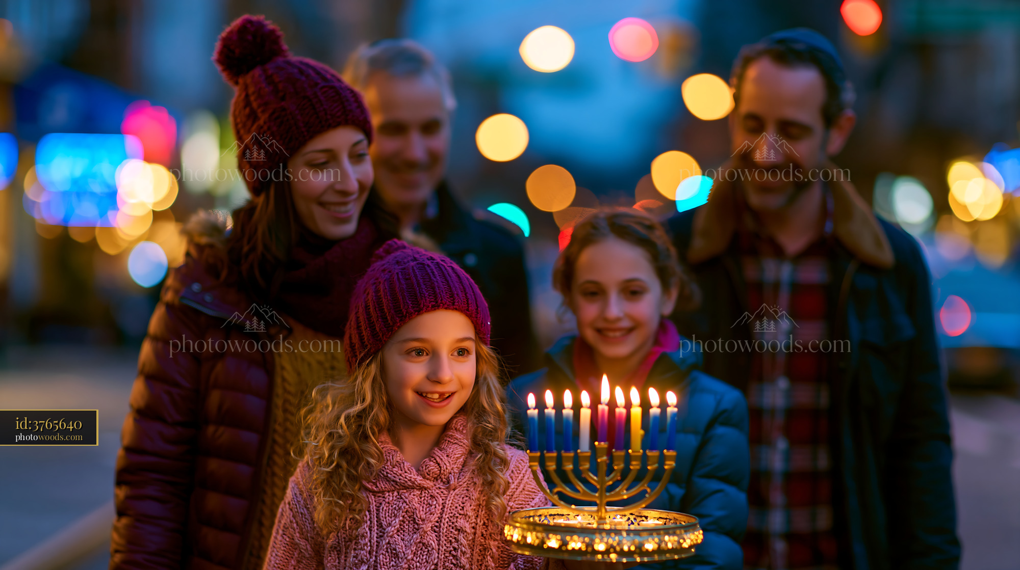 Family Lighting a Menorah for Hanukkah in the City at Night