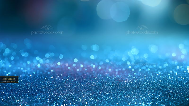 Blue glitter background with sparkling bokeh lights
