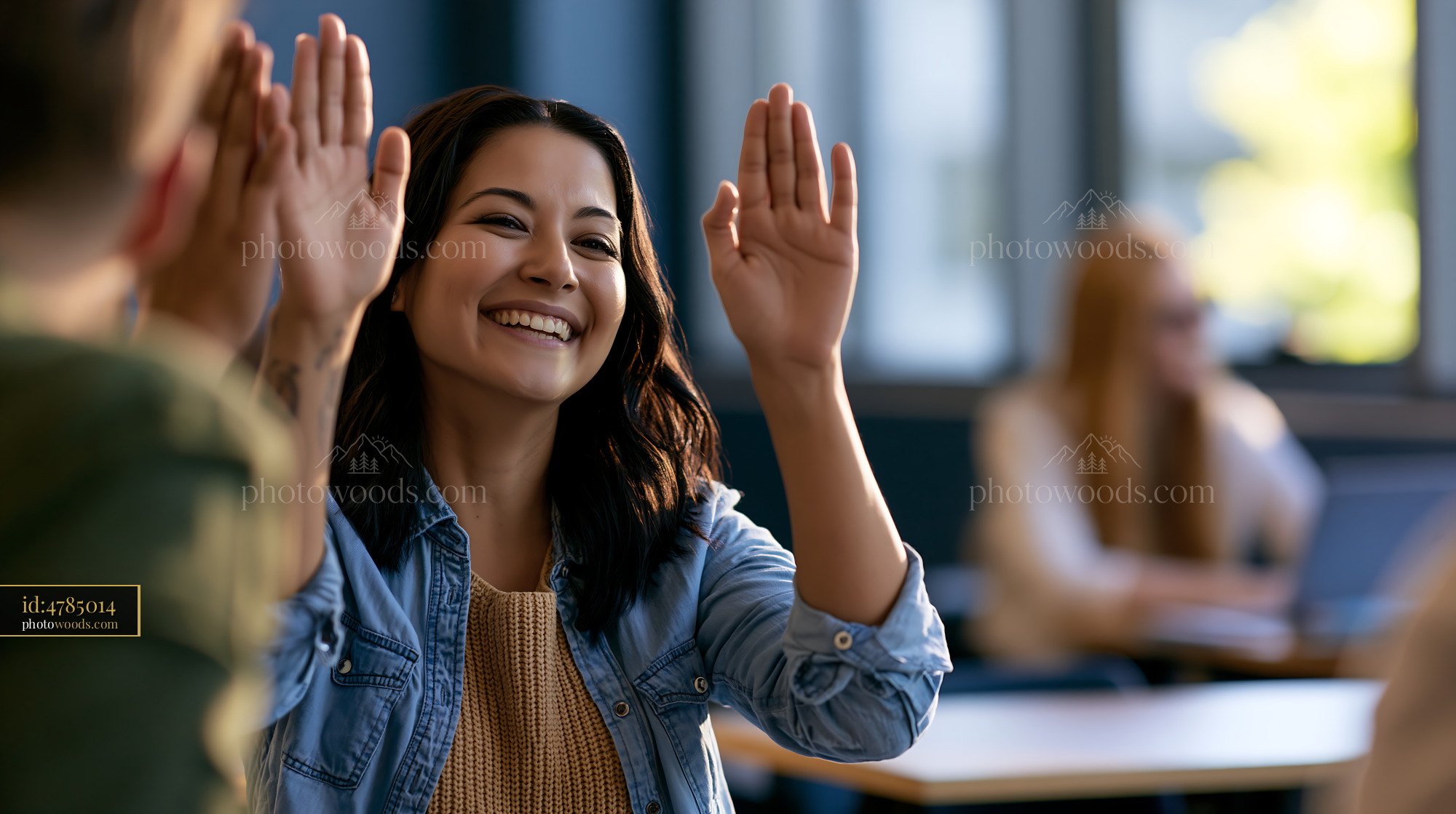 Laughing Student High-Fiving in Classroom