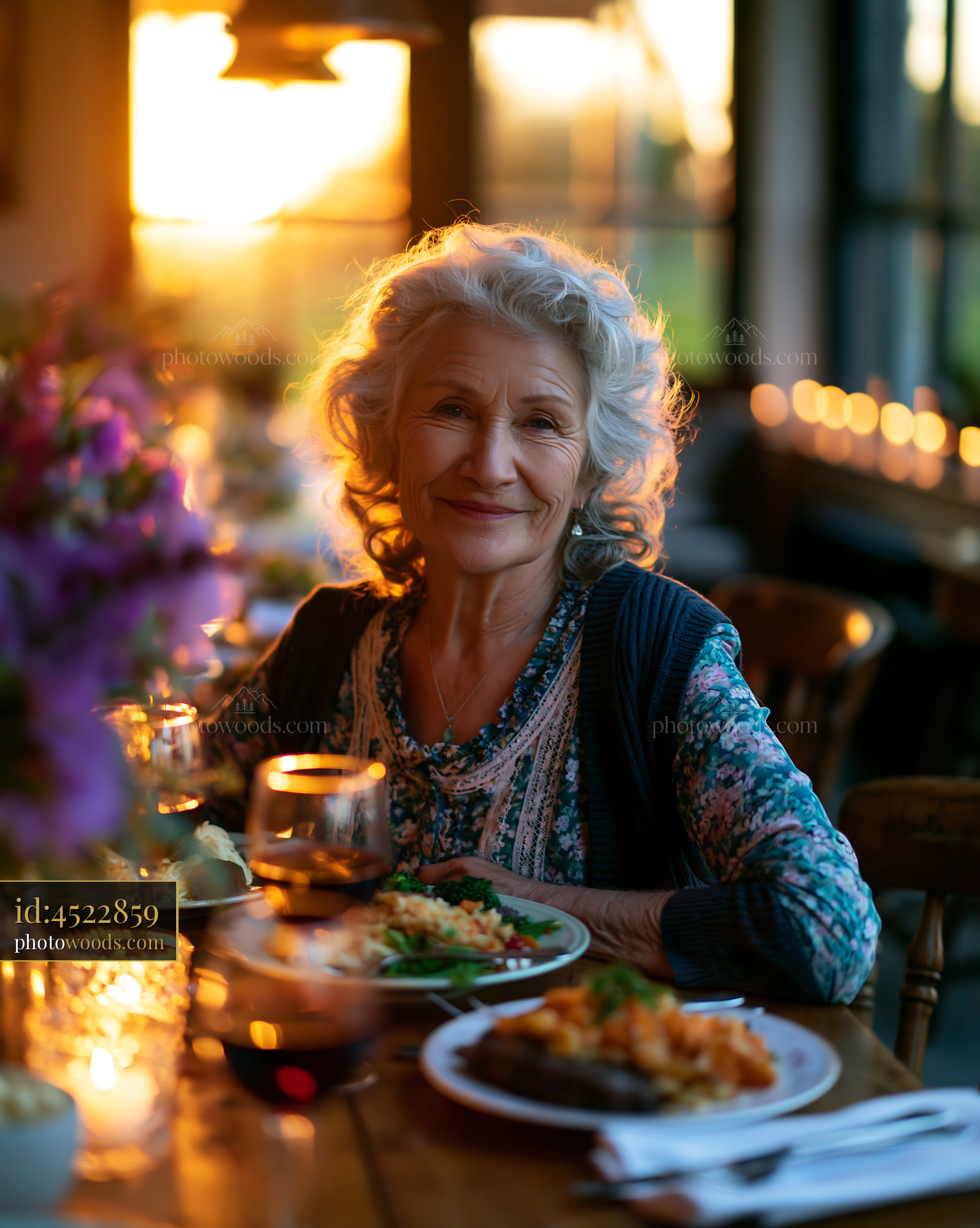 Older Woman Enjoys Meal With Sunset View and Candlelight