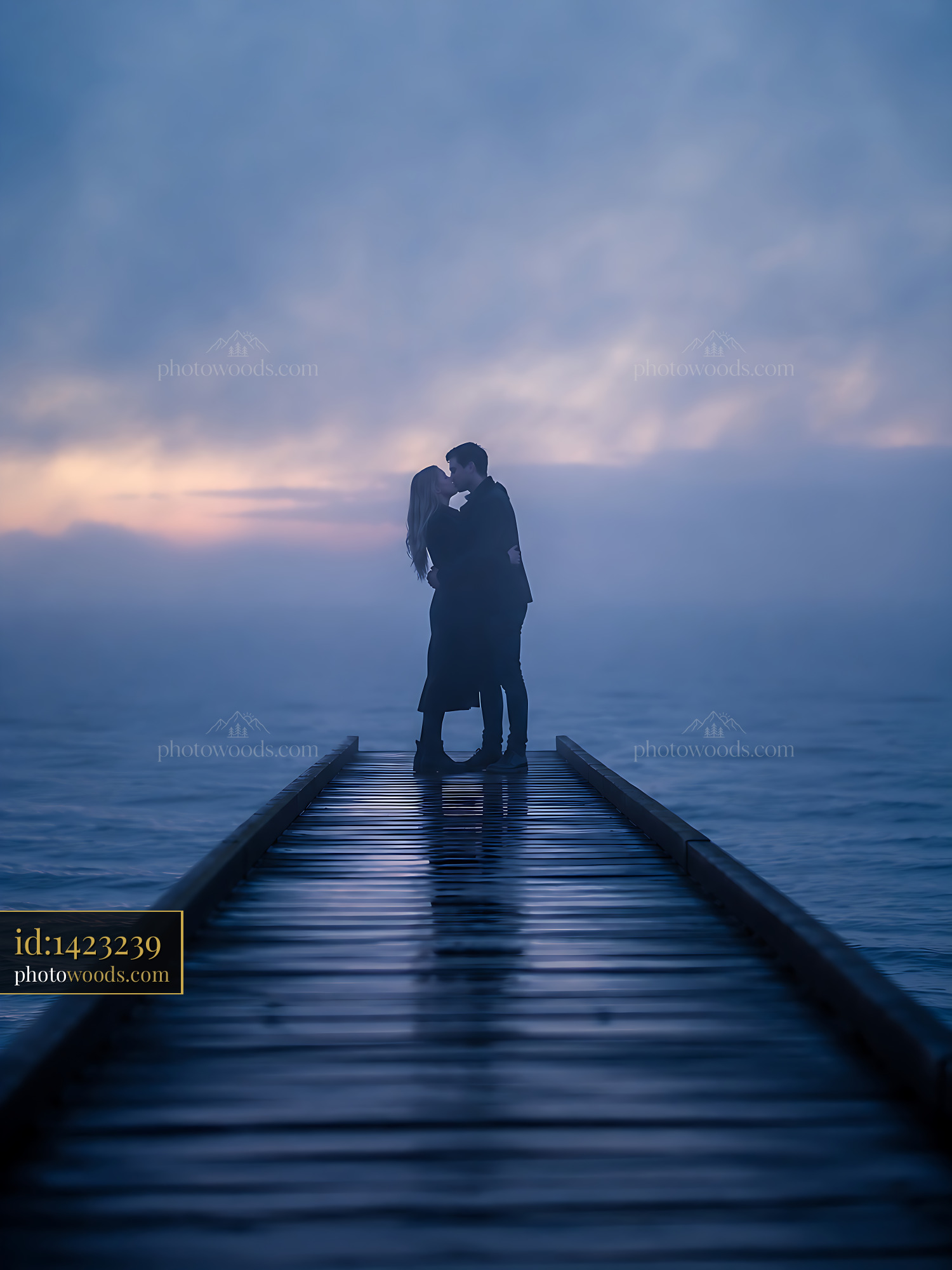 Couple Embraces at Sunset on Wooden Dock Over Calm Water