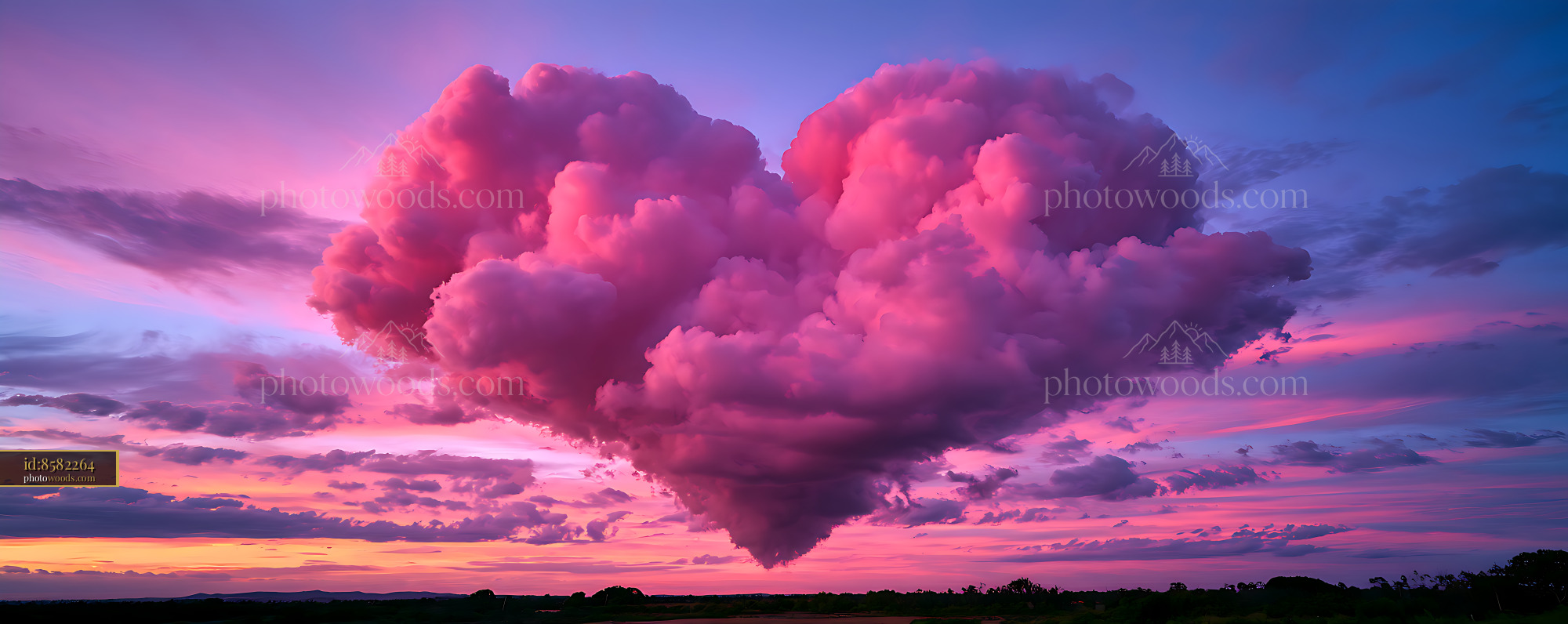 Dramatic pink cumulonimbus clouds at sunset