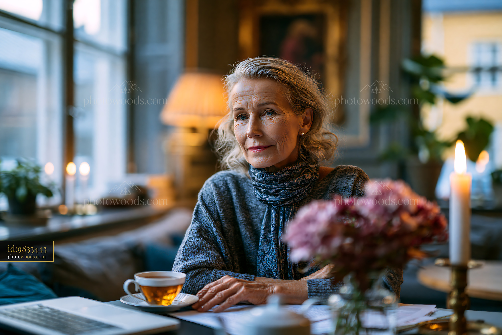 Woman Enjoying Tea in a Cozy Cafe With Soft Lighting