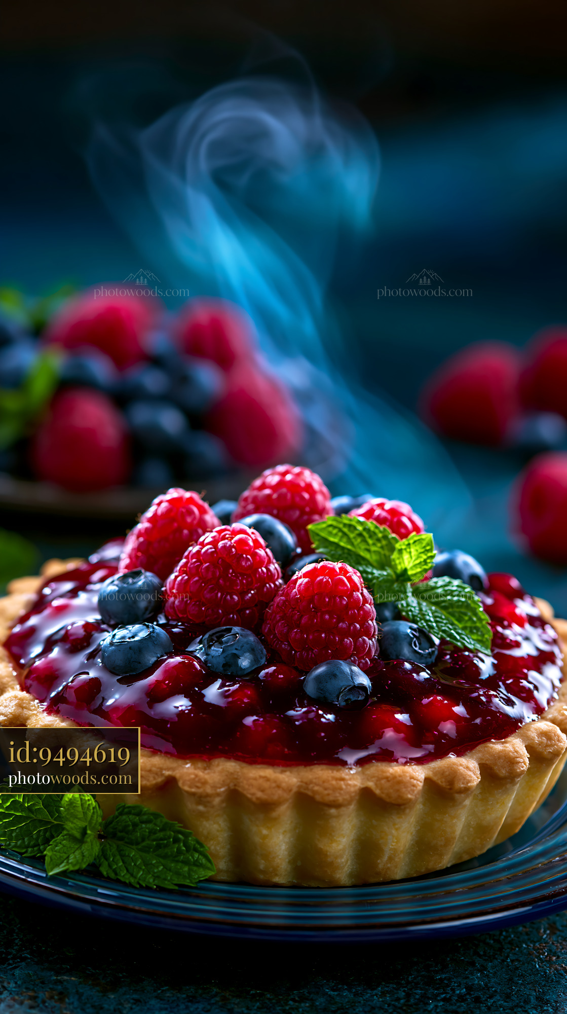 Berry Tart With Glossy Glaze and Fresh Mint Leaves