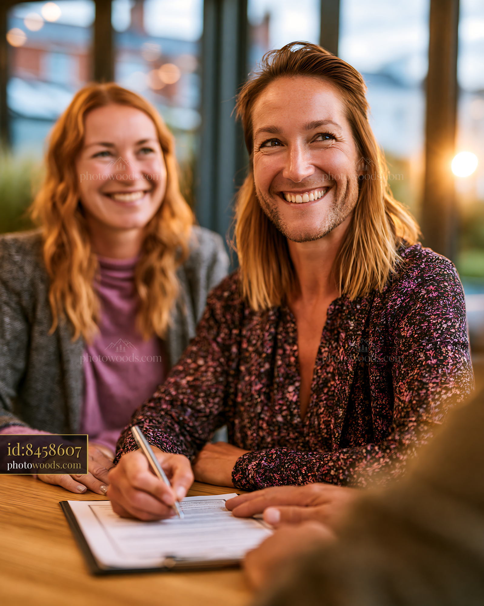 Couple Signing a Mortgage Contract Inside a Bank Office