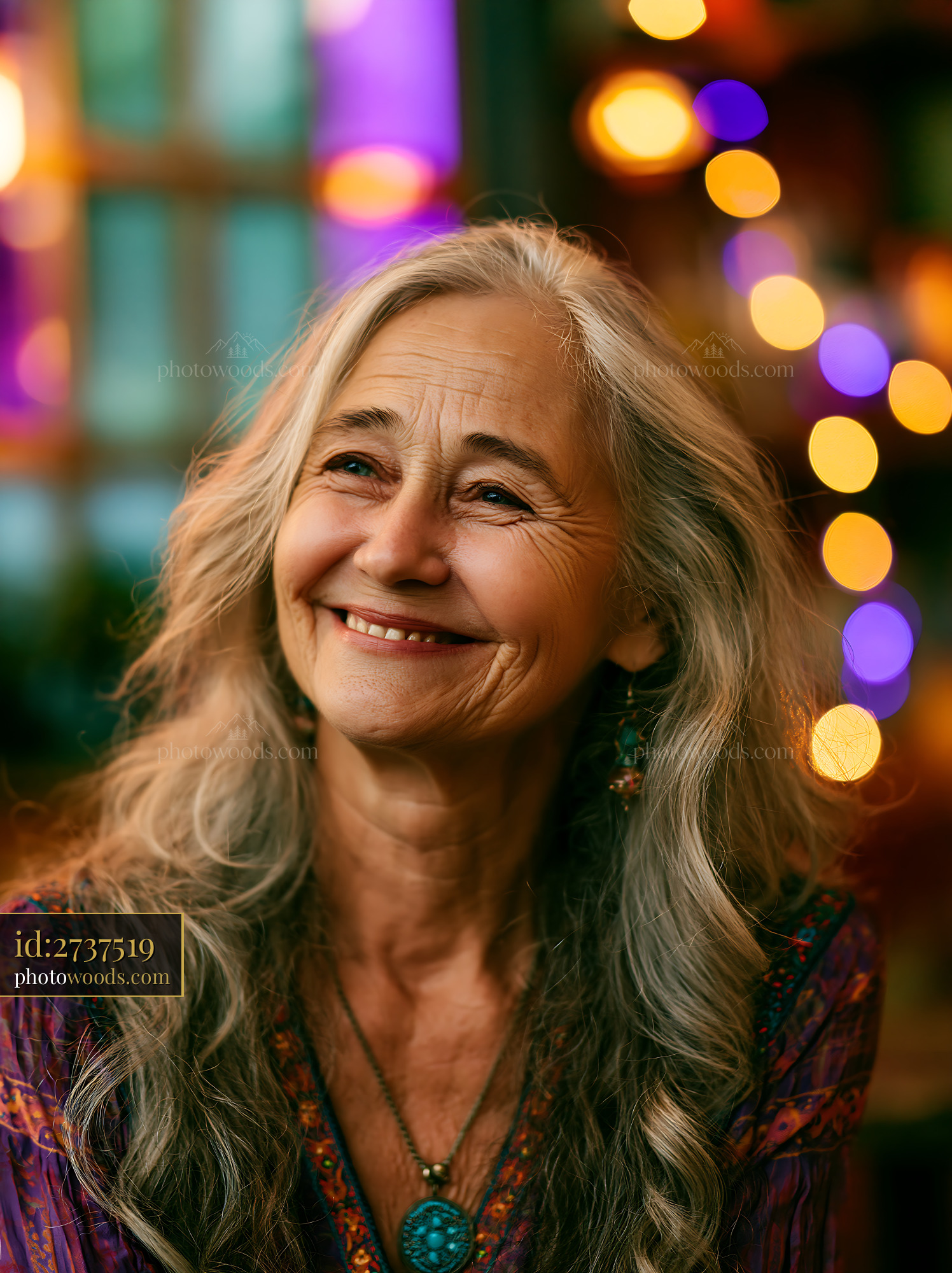 Woman Smiles in Colorful Setting With Lights and Soft Focus