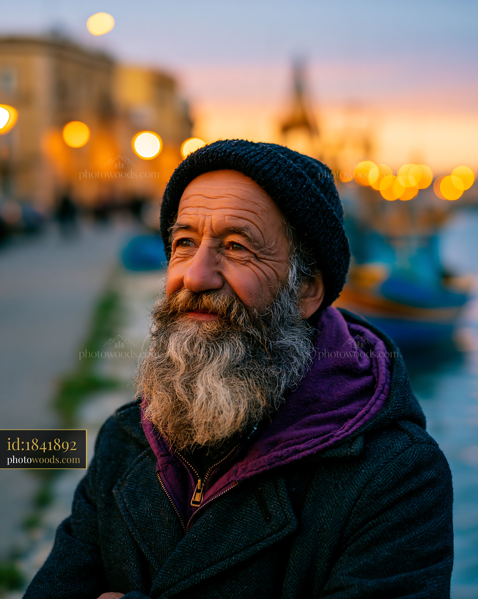 Man With a Beard Standing by a Waterfront During Sunset