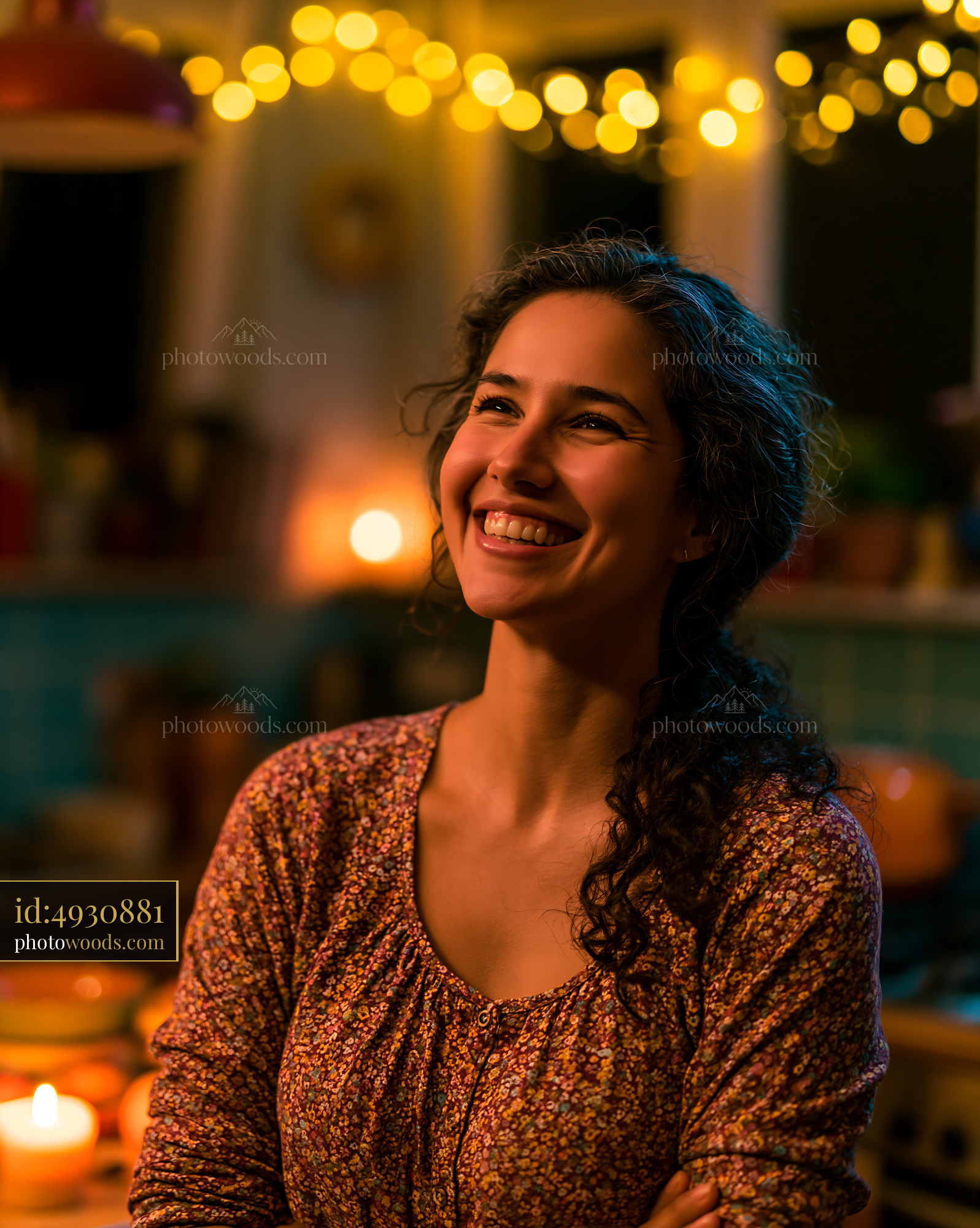Woman Smiling in a Cozy Kitchen With Warm Light Decor