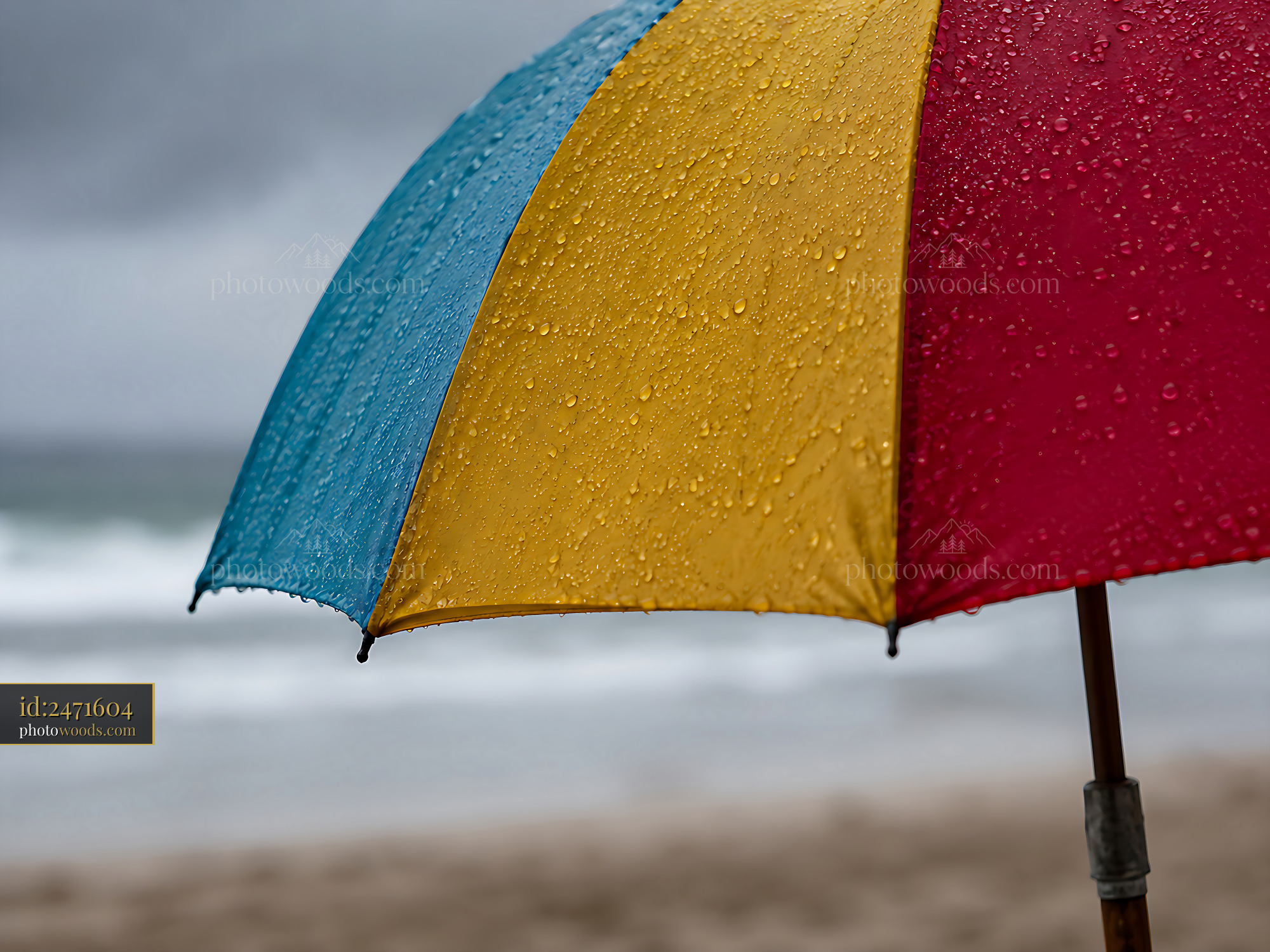 Umbrella With Raindrops at the Beach During Cloudy Weather