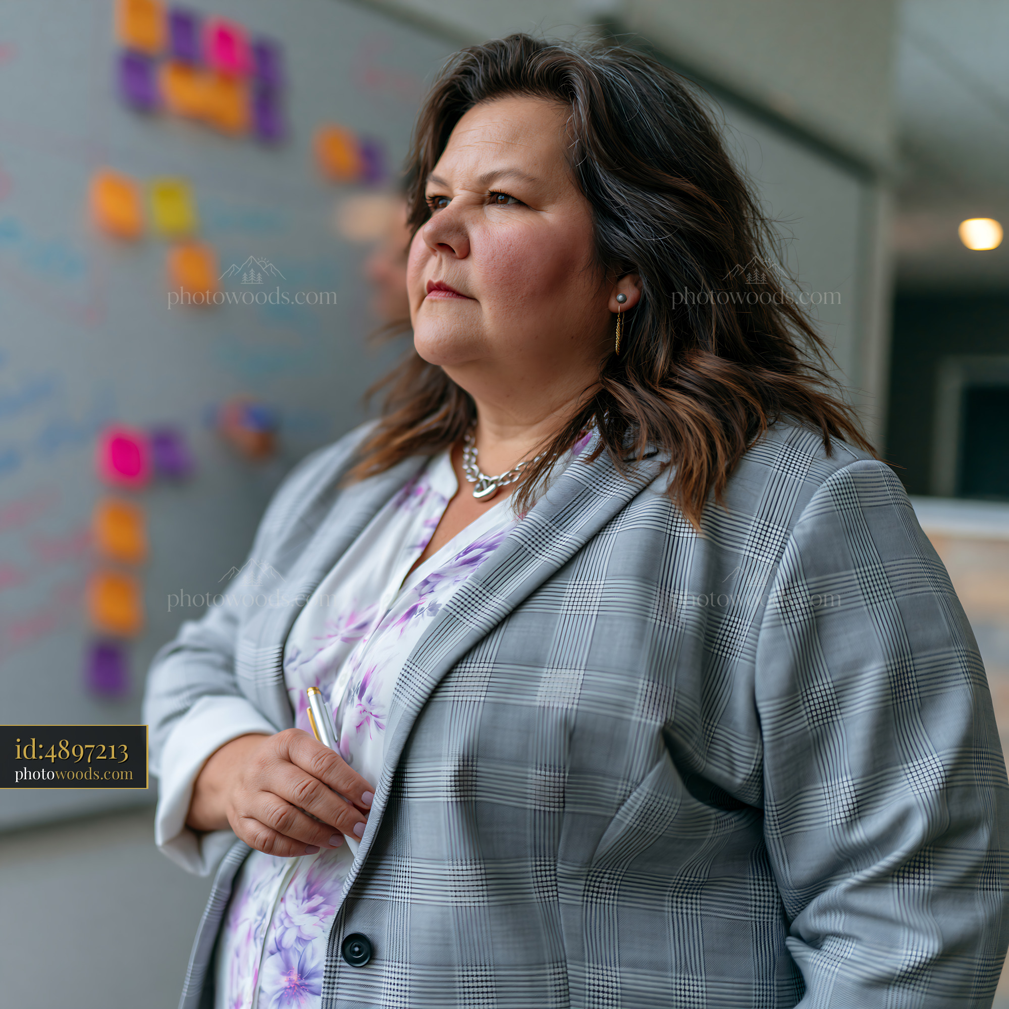 Plus Size Businesswoman in Tailored Suit During Office Meeting
