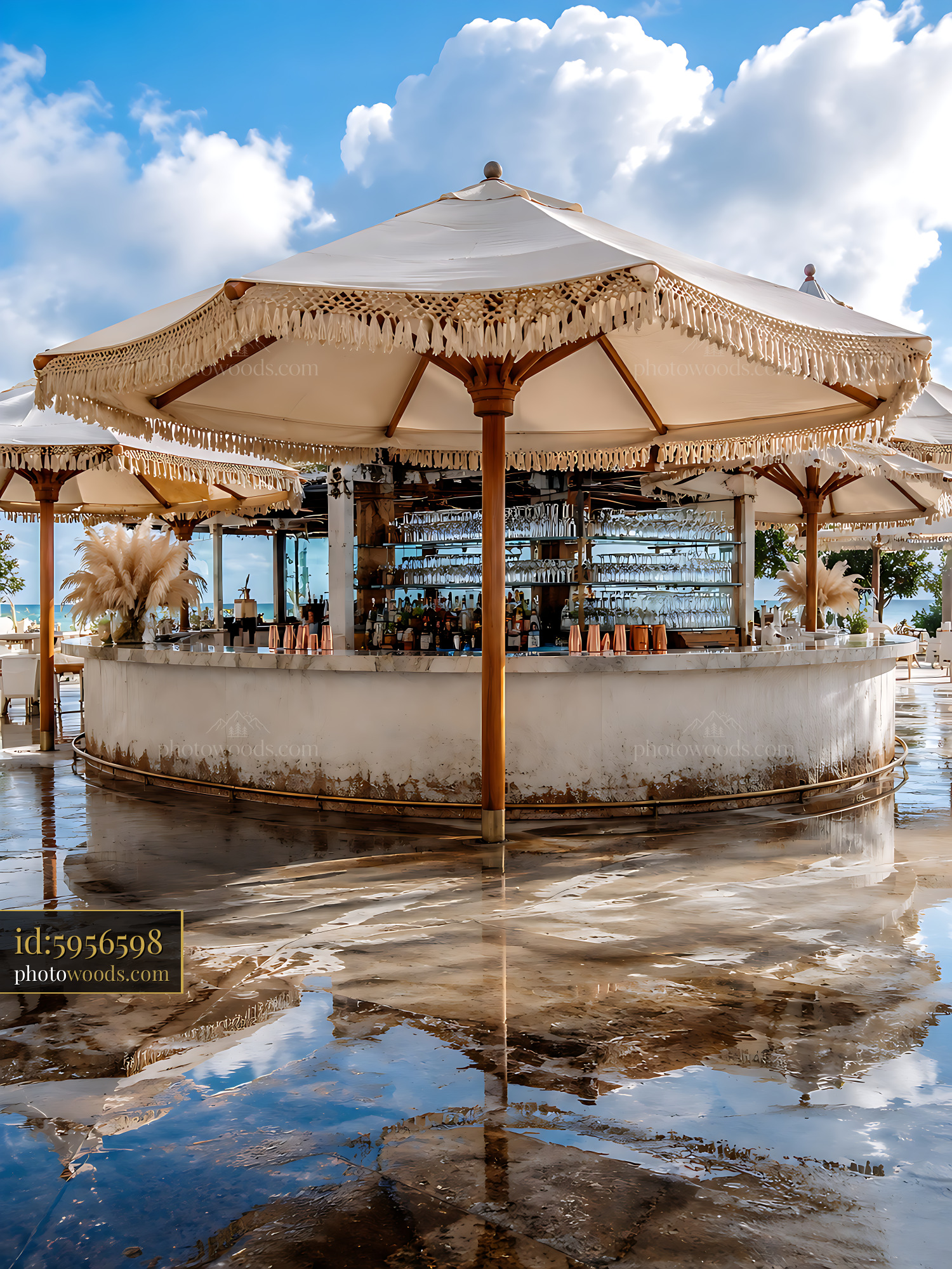 Bar Structure With Thatched Canopy Reflects in Water at Resort