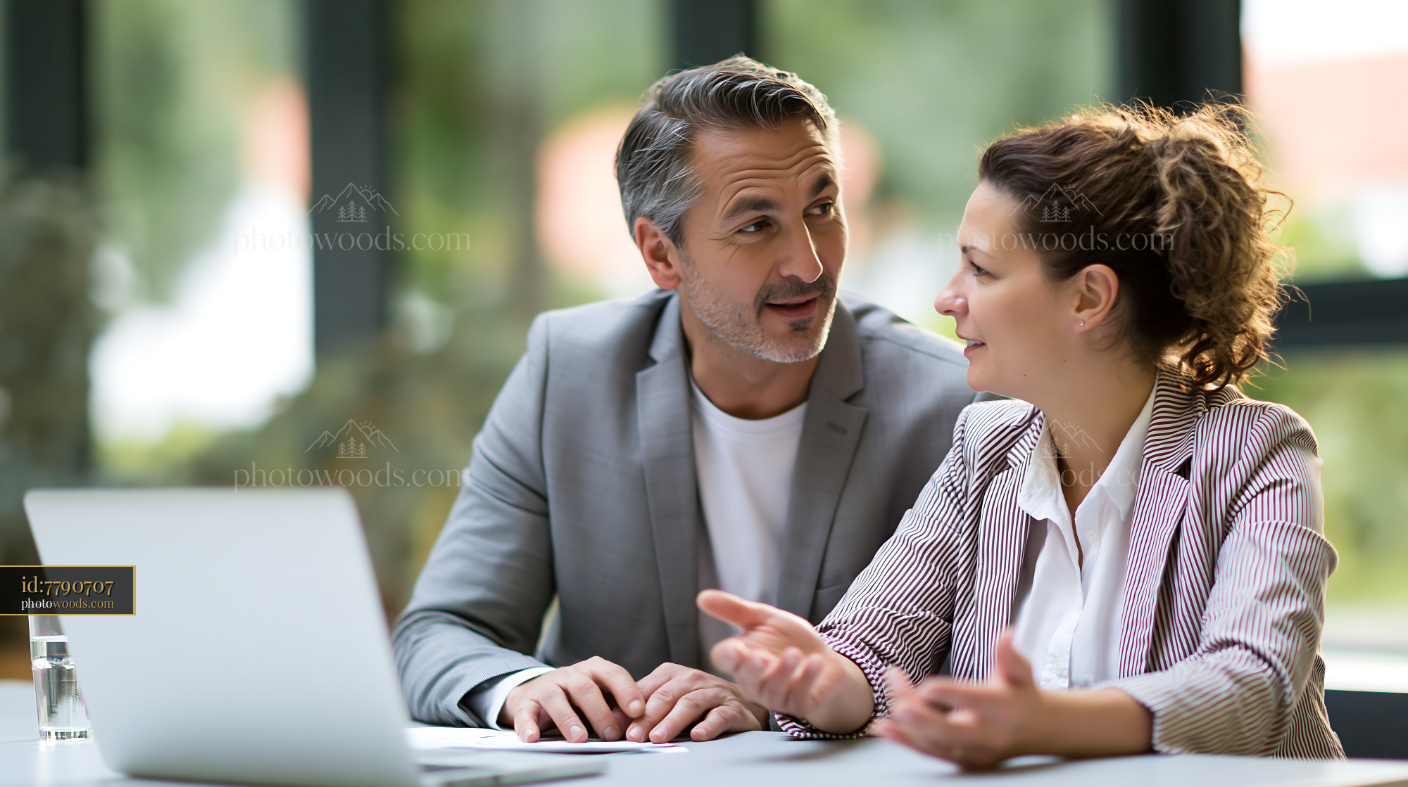 Tax Consultant and Client Discussing Financial Matters in Office