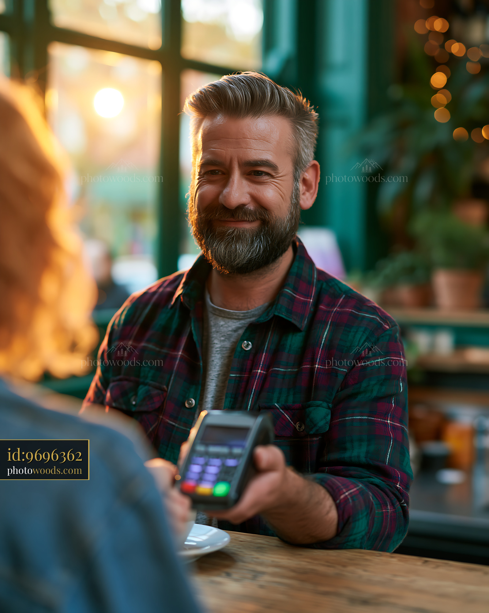 Tax Consultant Working With Client in Coffee Shop During Sunset