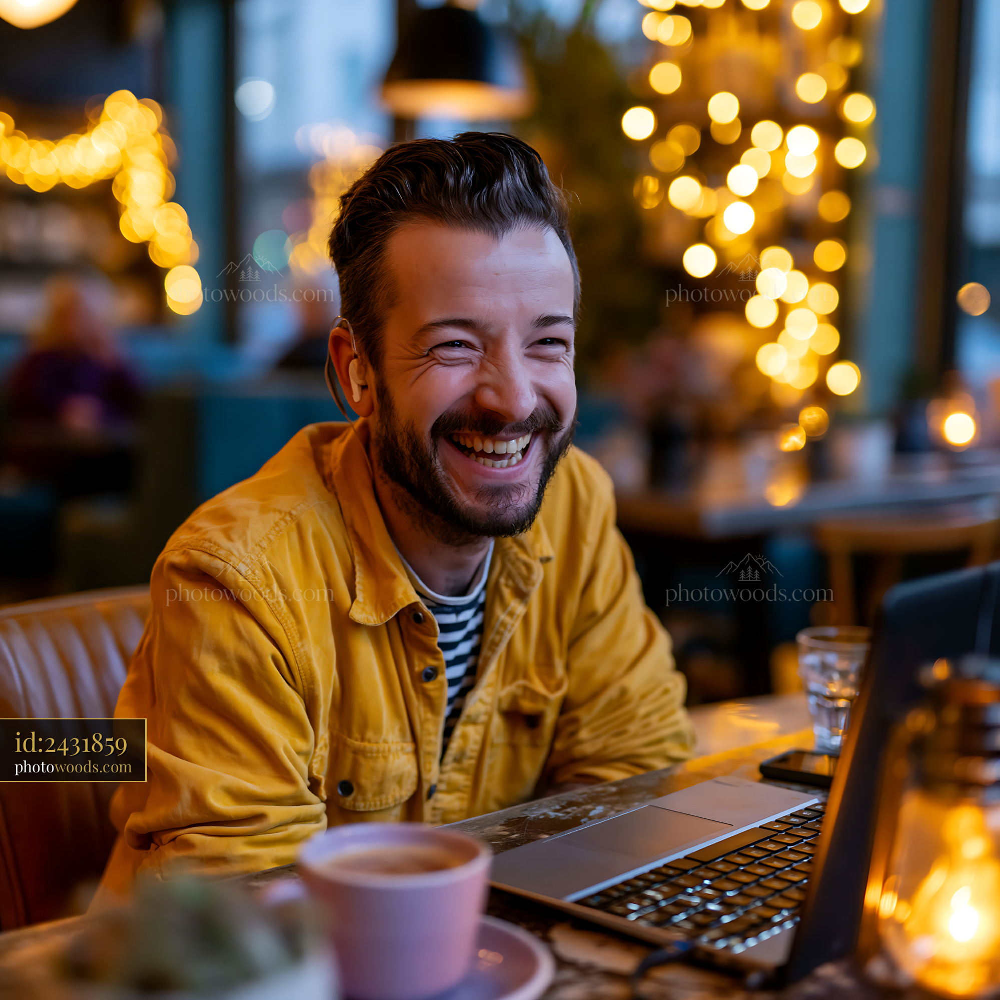 Joyful Software Developer Working in a Cozy Cafe With Warm Lights