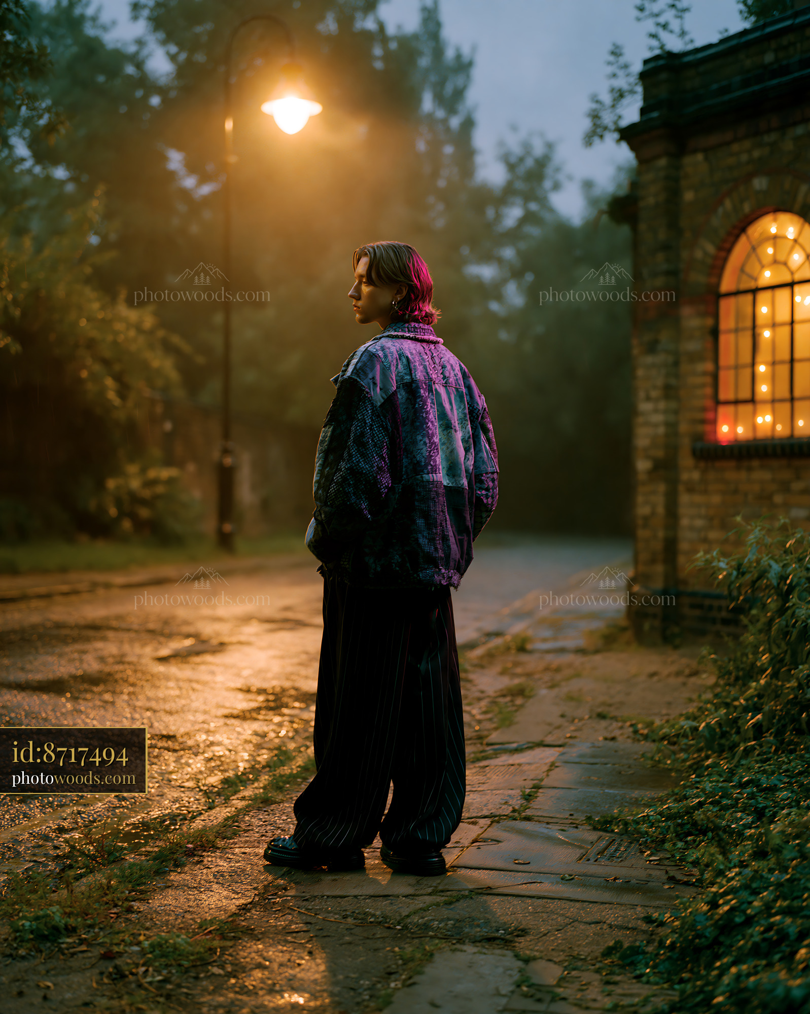 Androgynous Model in Urban Setting at Dusk With Streetlight Glow