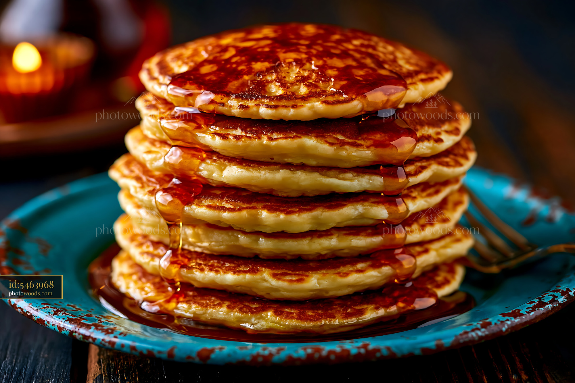Stack of Fluffy Pancakes With Maple Syrup on a Blue Plate