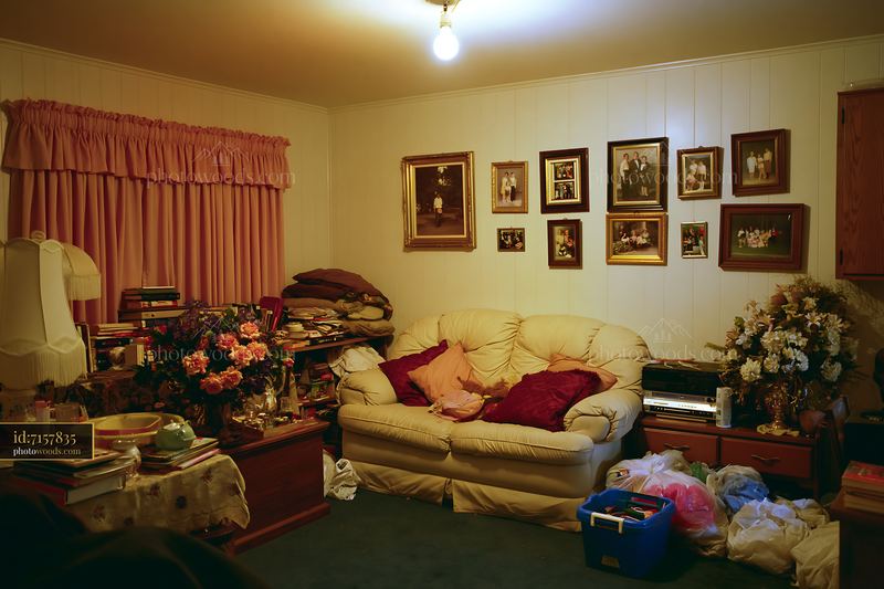Cluttered Hoarder Style Living Room With Family Memories