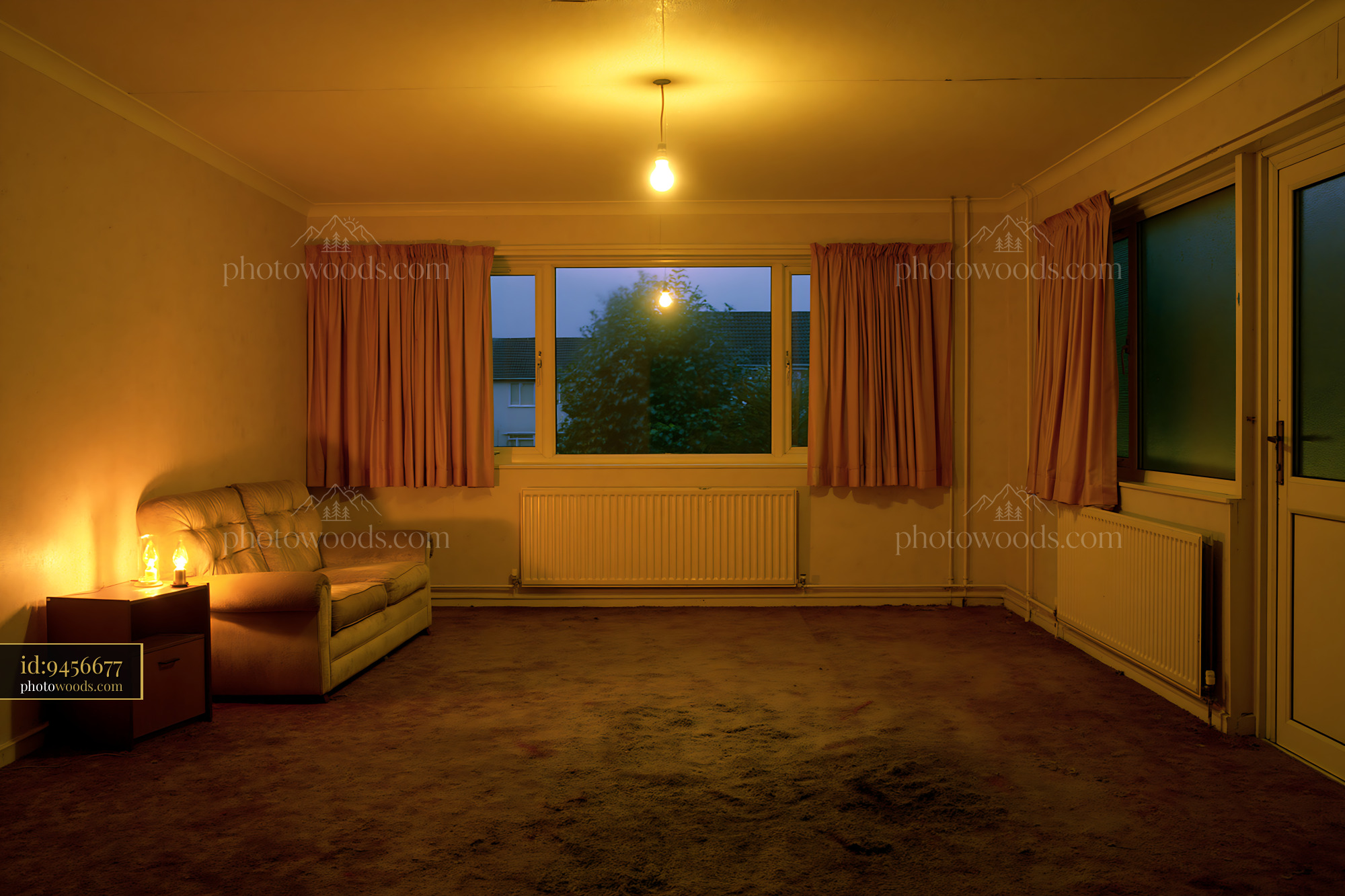 Living Room in a Cramped Panel Building During Twilight