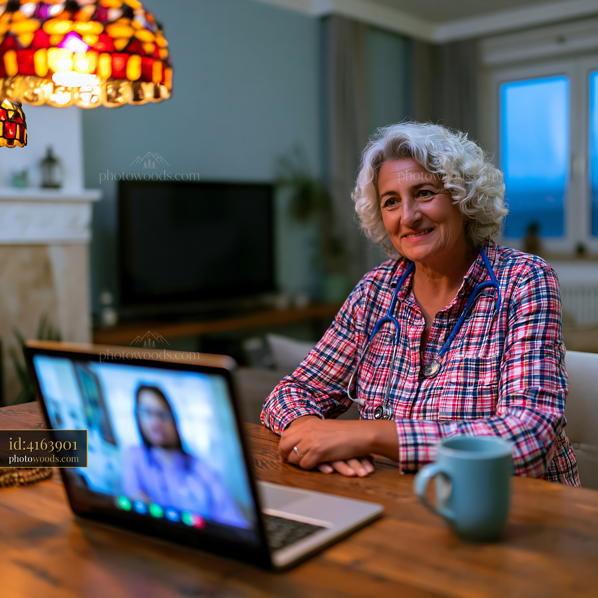 Doctor in Telemedicine Video Consultation at Home With a Patient